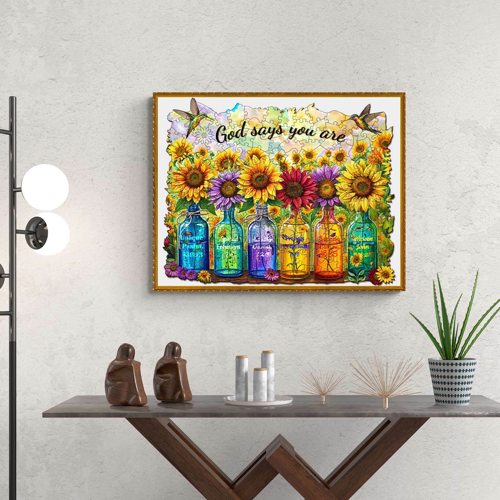 Colorful artwork featuring bottles and sunflowers with the phrase 'God says you are' above, perfect for uplifting decor.