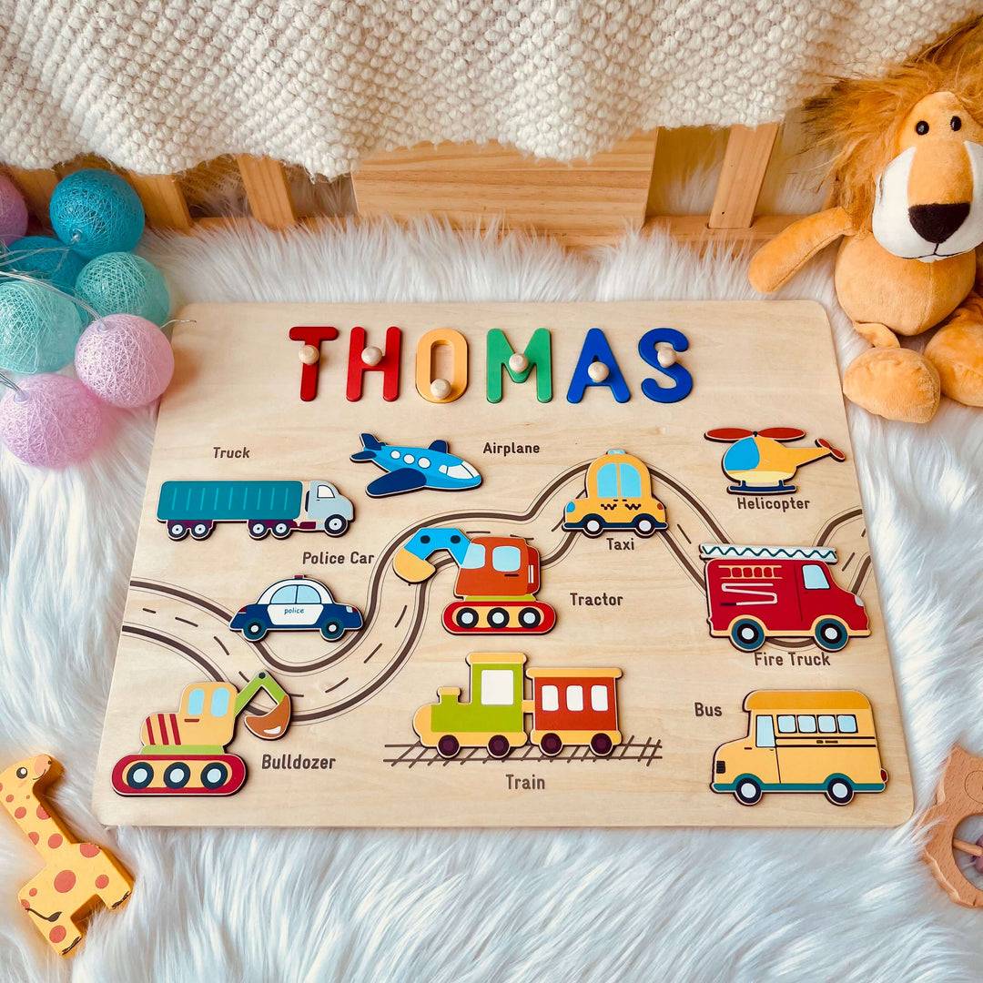 Personalized Traffic Name Puzzle featuring child's name 'Thomas' with colorful vehicles like trucks, airplanes, and police cars.