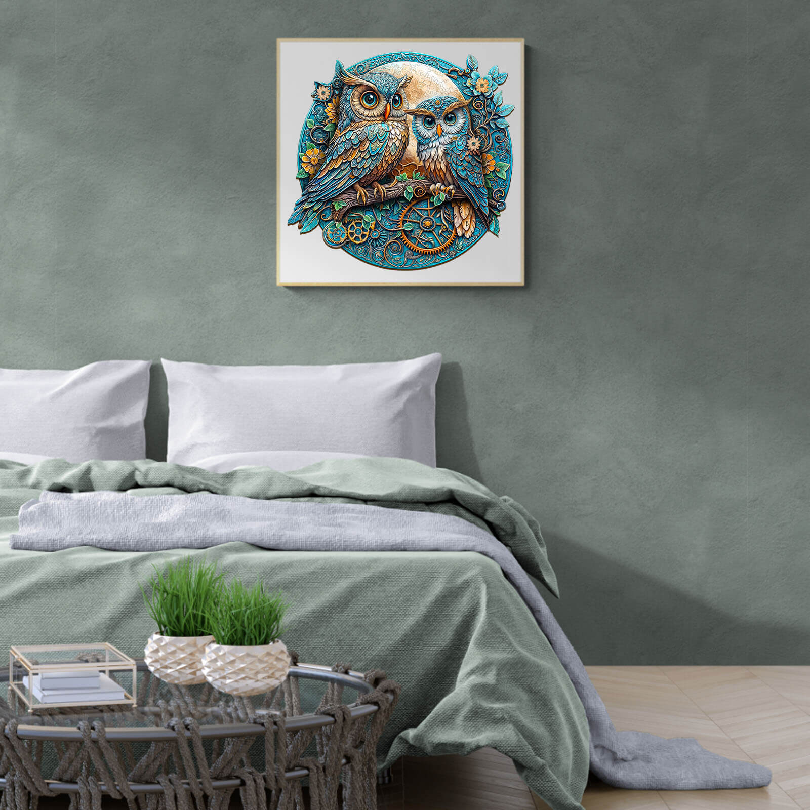 Stylish bedroom decor featuring an embossed owl artwork above a cozy bed with a green blanket.