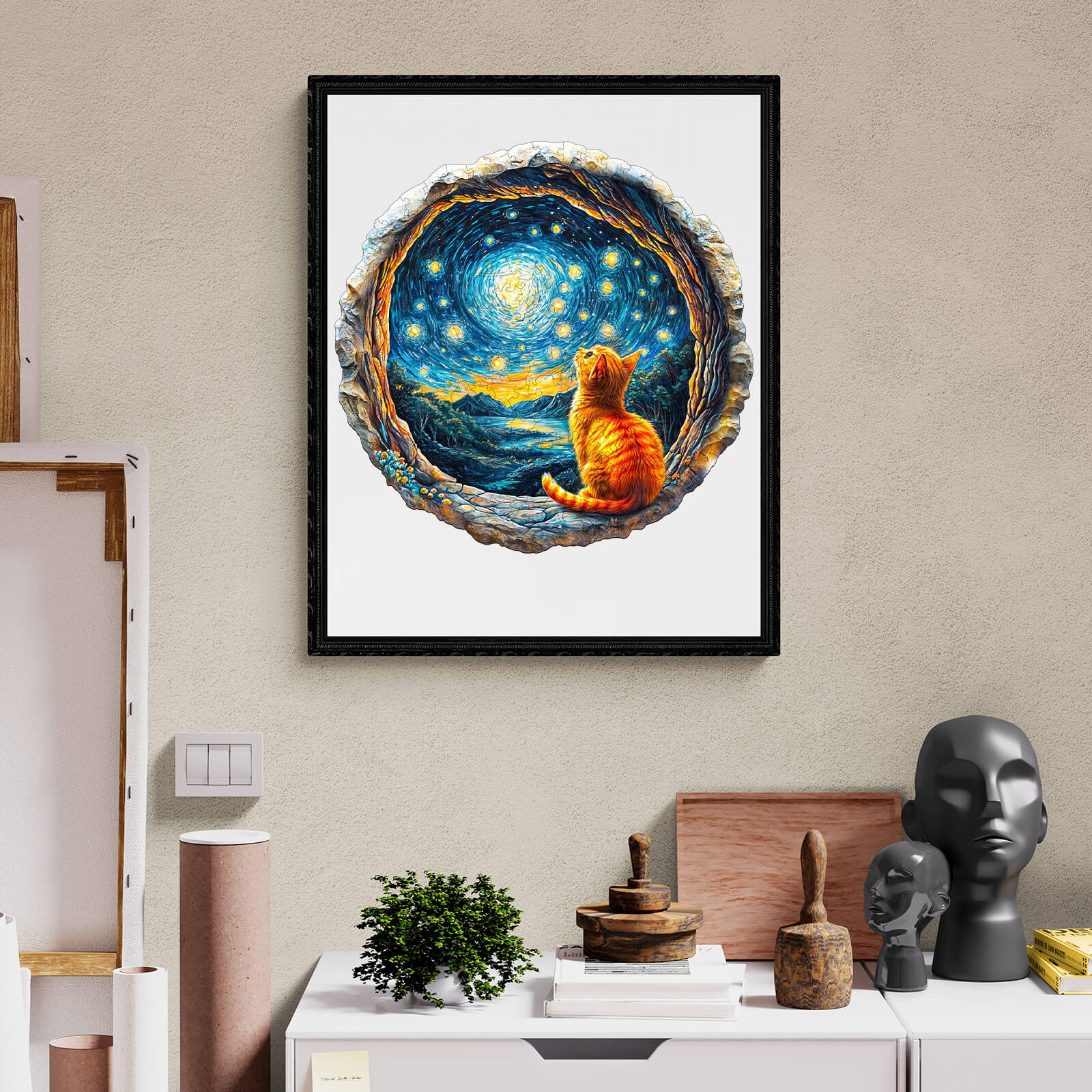 Framed artwork of a cat gazing at a starry night scene, adding a whimsical touch to any home decor.