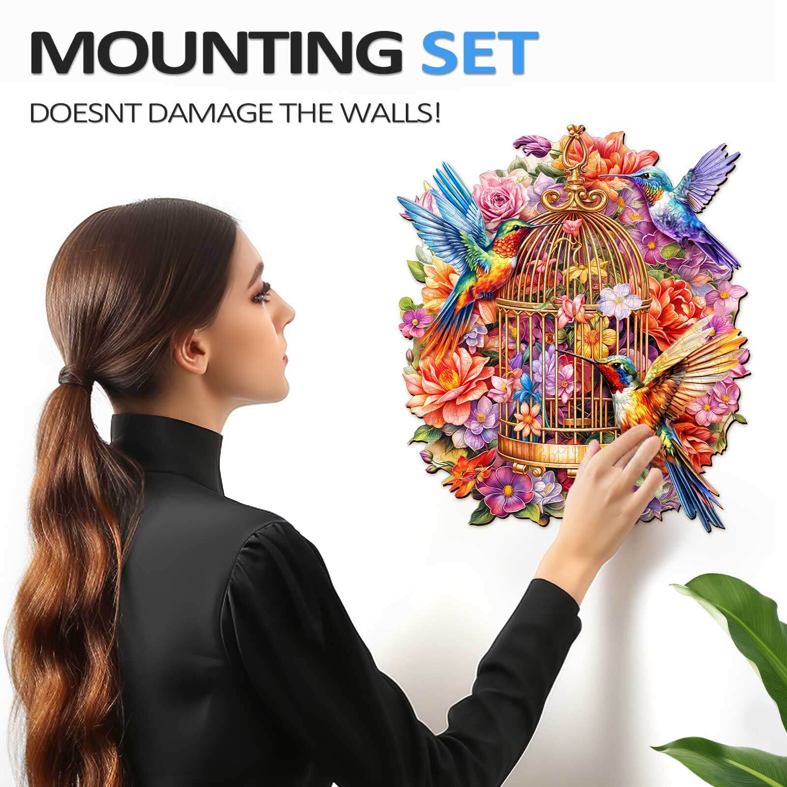 Person installing a colorful birdcage wall art with a mounting set that doesn't damage walls.