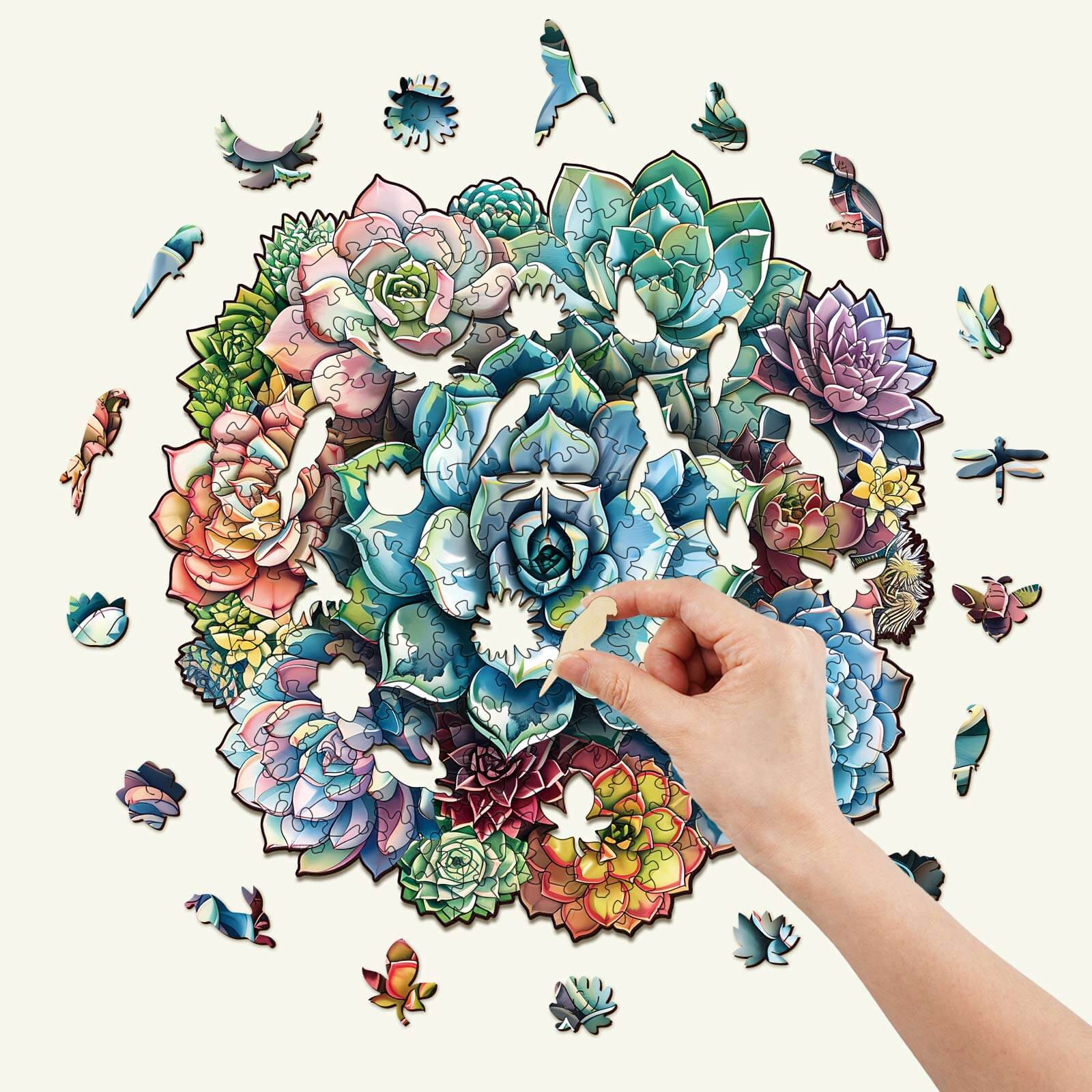Person assembling an Elegant Succulent Wooden Jigsaw Puzzle with vibrant plant designs, promoting focus and mindfulness.