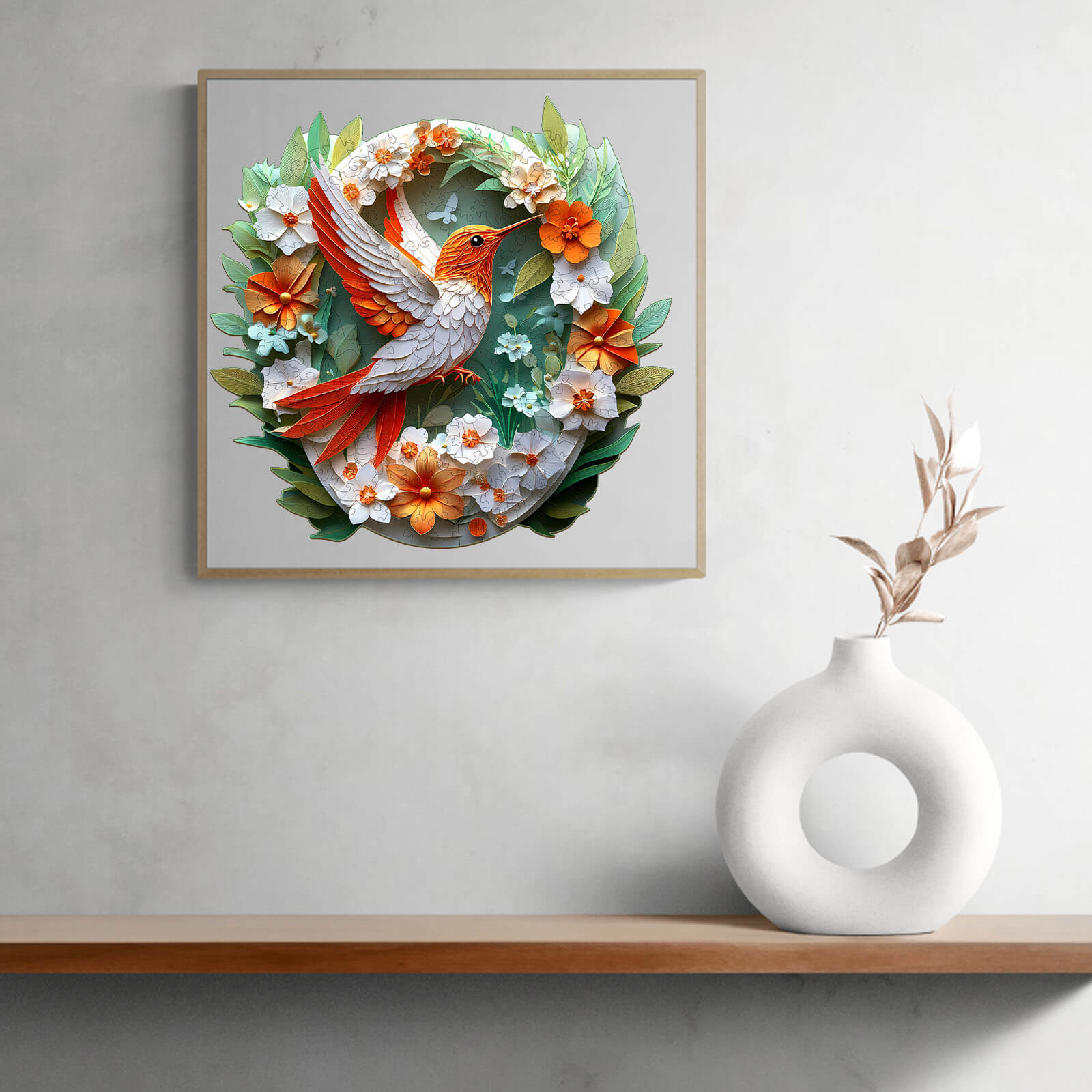 3D Colored Paper Carving Hummingbird puzzle artwork featuring vibrant flowers and leaves on a wall.