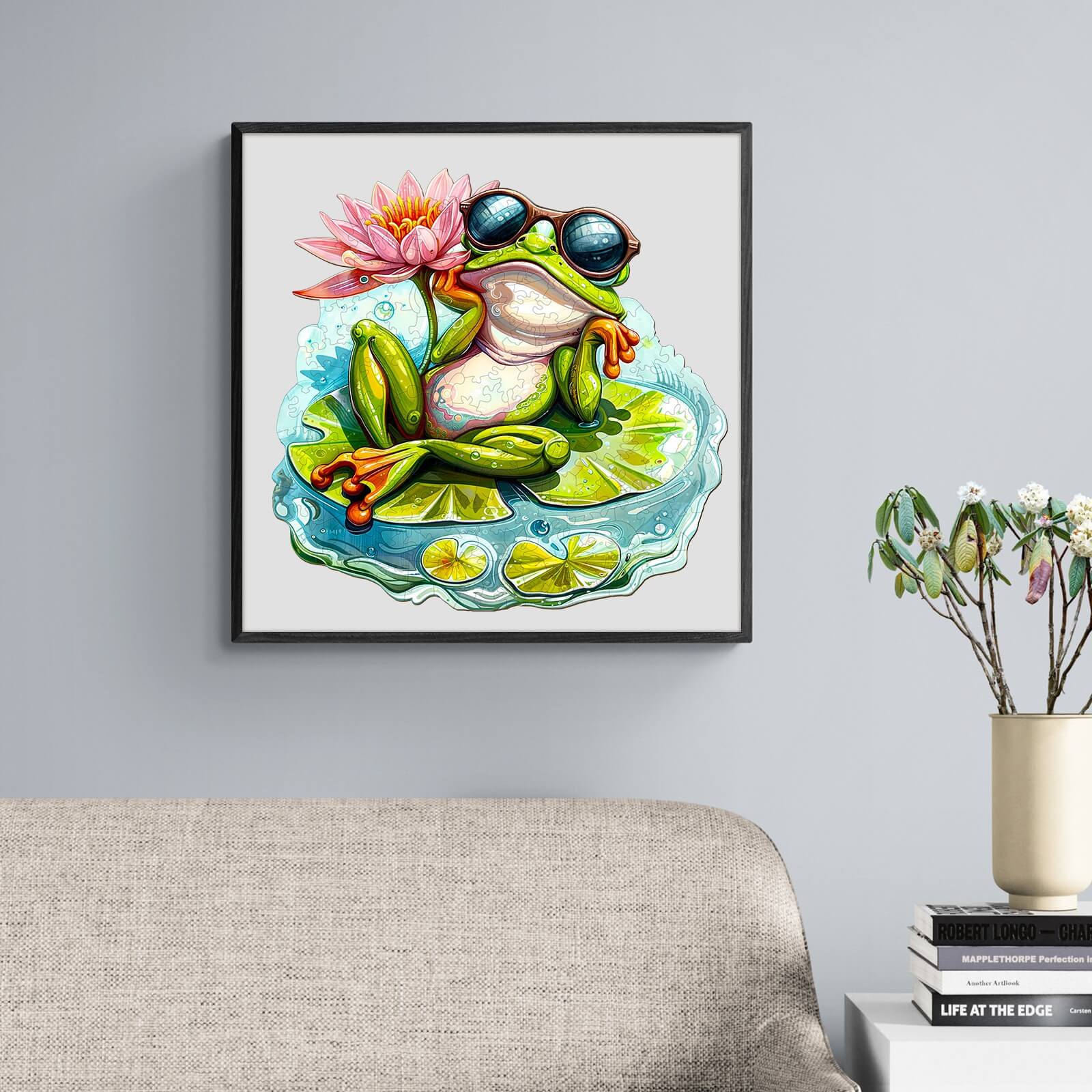 Colorful frog relaxing on a lily pad with sunglasses, surrounded by a flower, perfect for a playful jigsaw puzzle theme.
