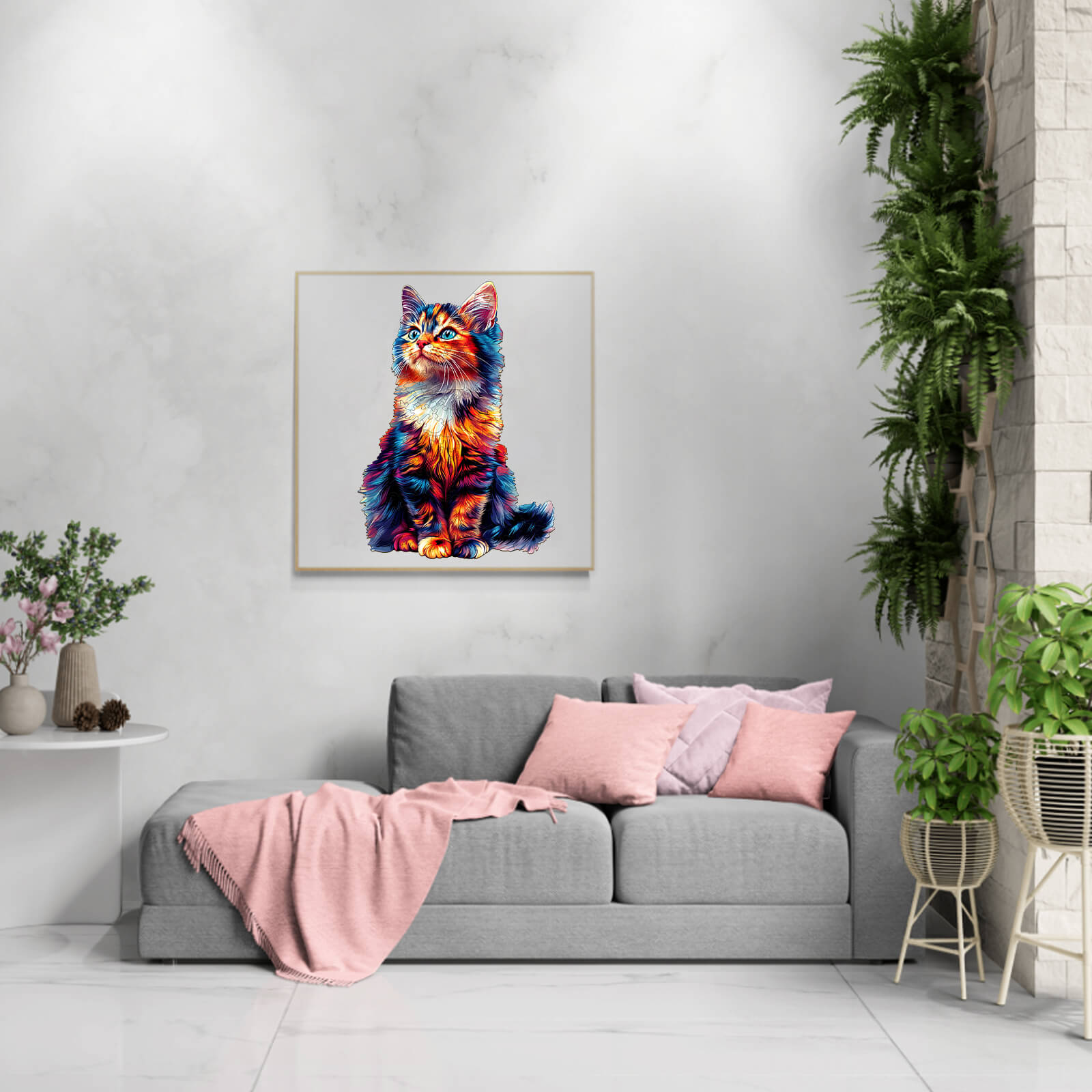 Vibrant colorful cat artwork above a cozy gray sofa with pink cushions in a modern living room setting.