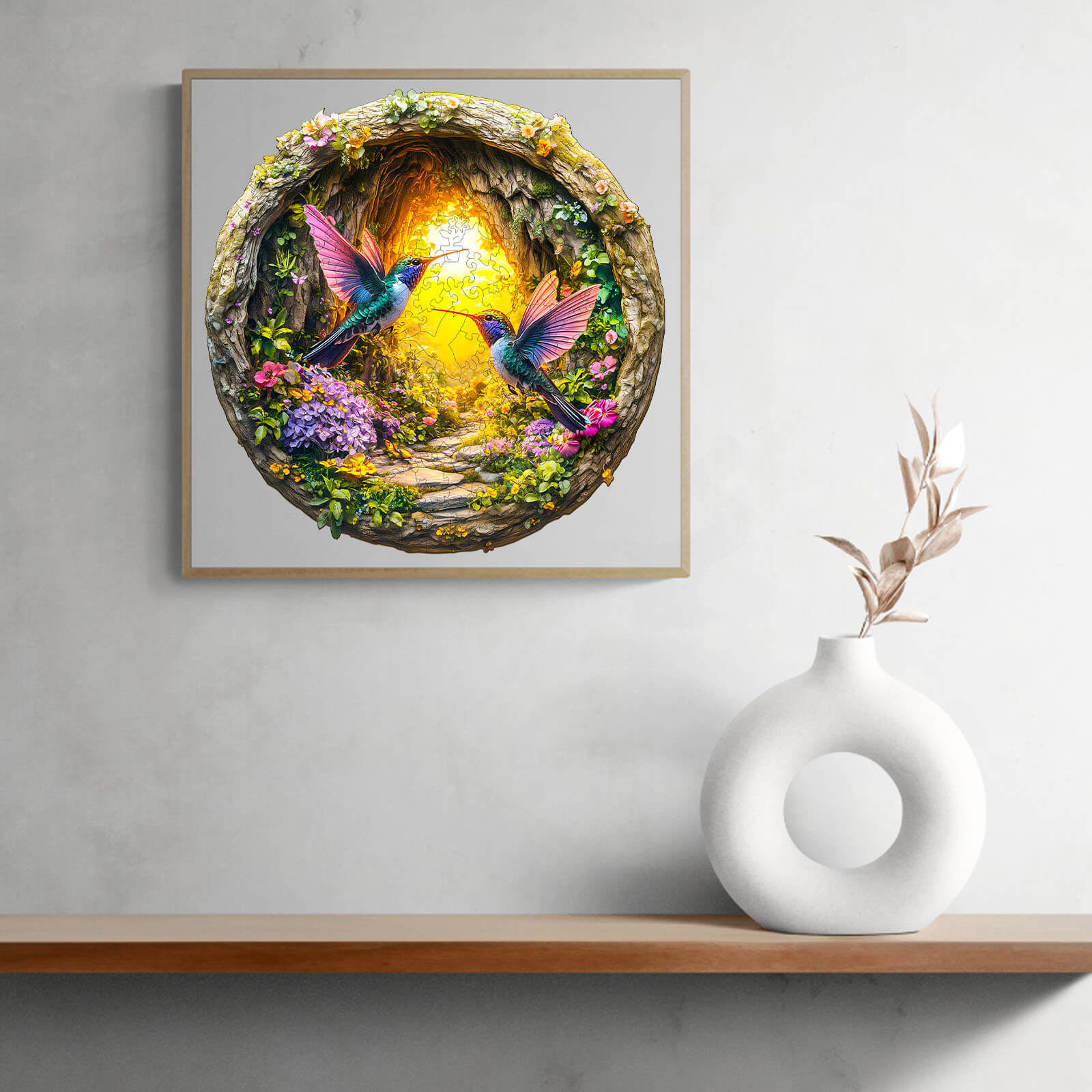 Colorful 3D wooden jigsaw puzzle featuring hummingbirds in a cave surrounded by flowers and light.