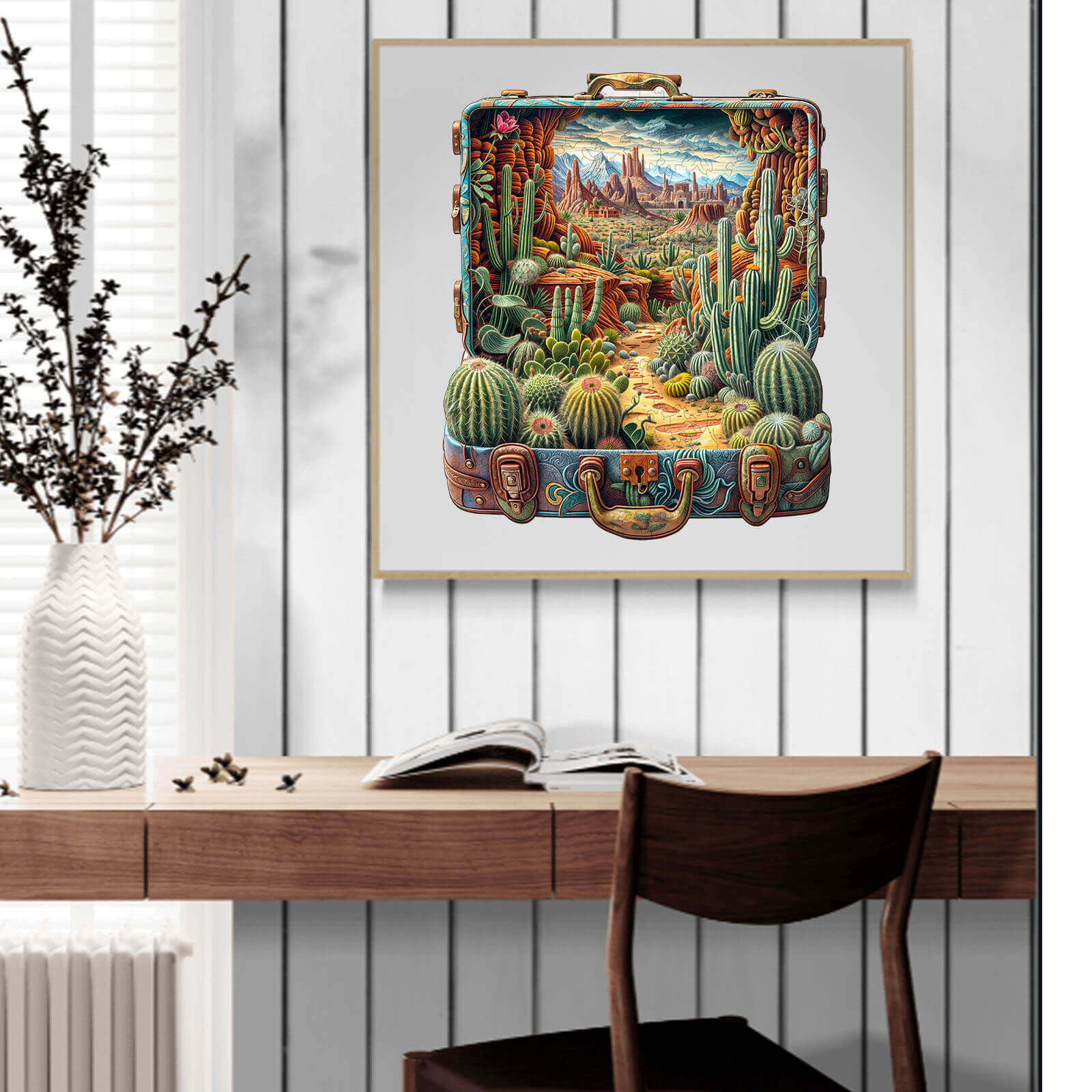 Decorative wooden puzzle art depicting a vibrant desert landscape with cacti and mountains in a suitcase theme.