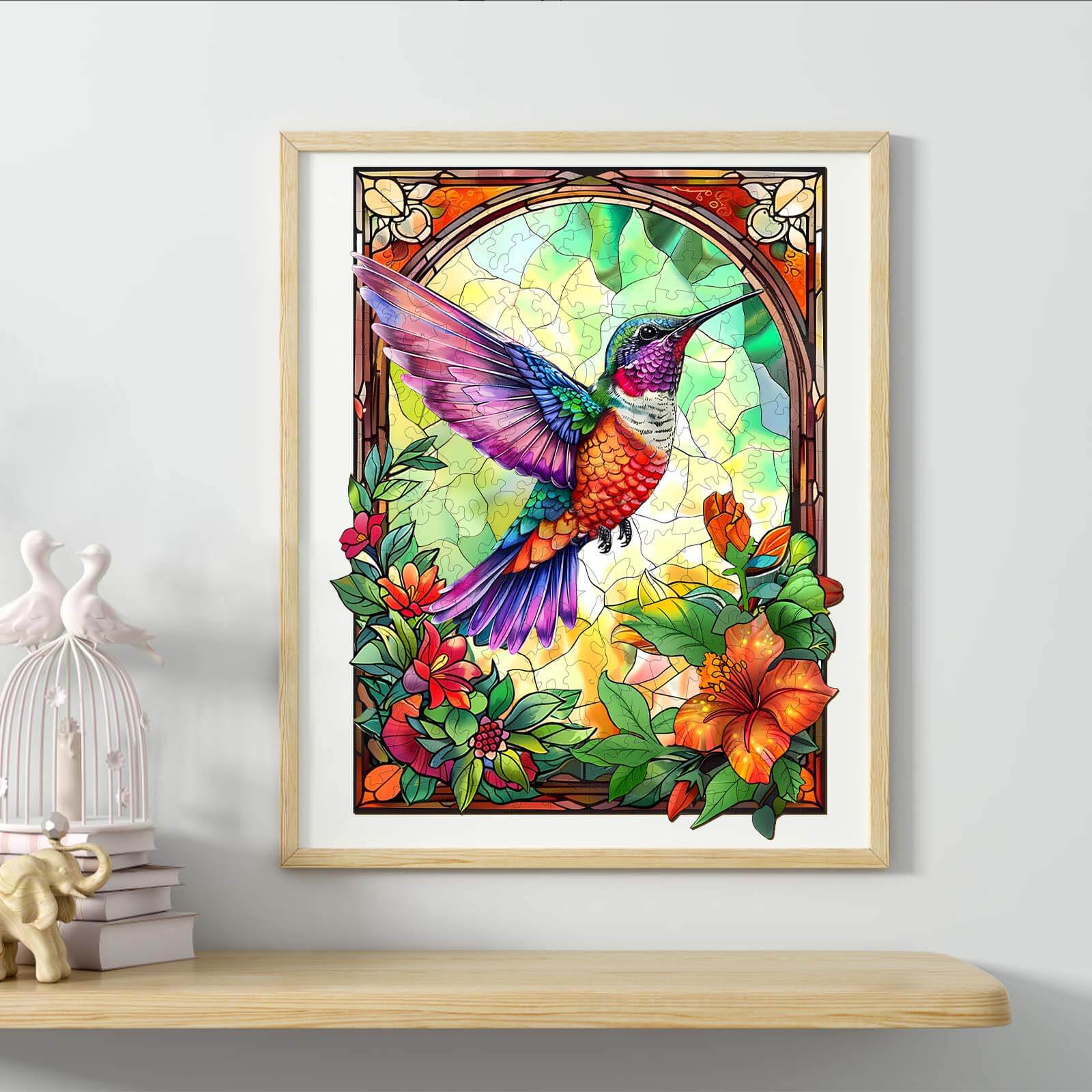 Colorful stained glass hummingbird artwork framed with vibrant flowers and greenery, perfect for home decor.