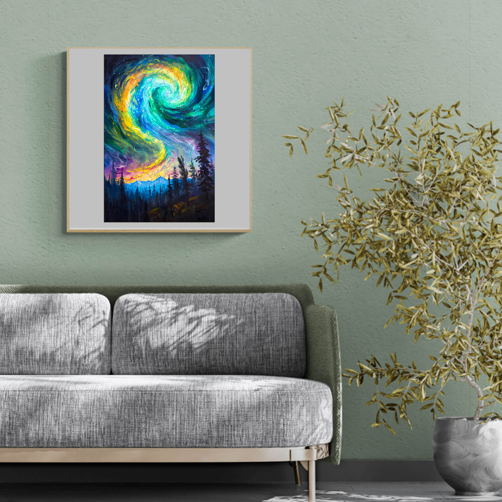 Colorful swirling night sky artwork framed above a modern gray sofa in a stylish living room setting.