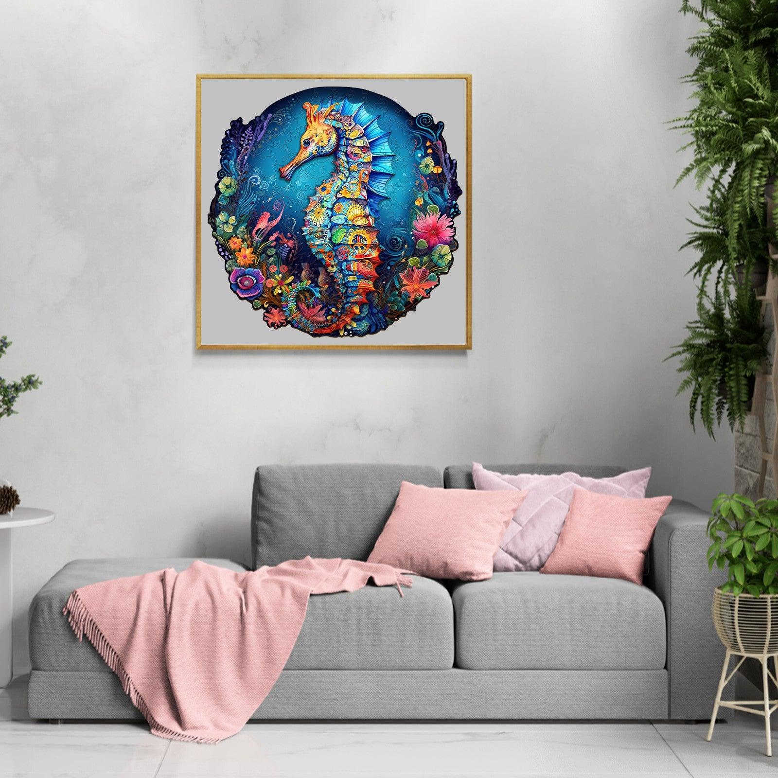Colorful seahorse artwork displayed on a wall above a modern gray couch, showcasing vibrant marine life.