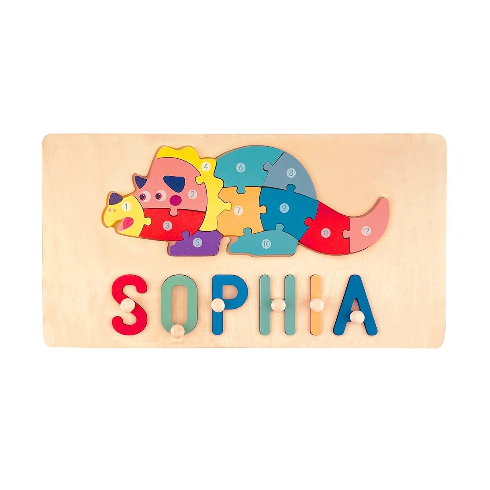 Personalized wooden animal name puzzle featuring a colorful dinosaur and the name 'SOPHIA' for toddlers.