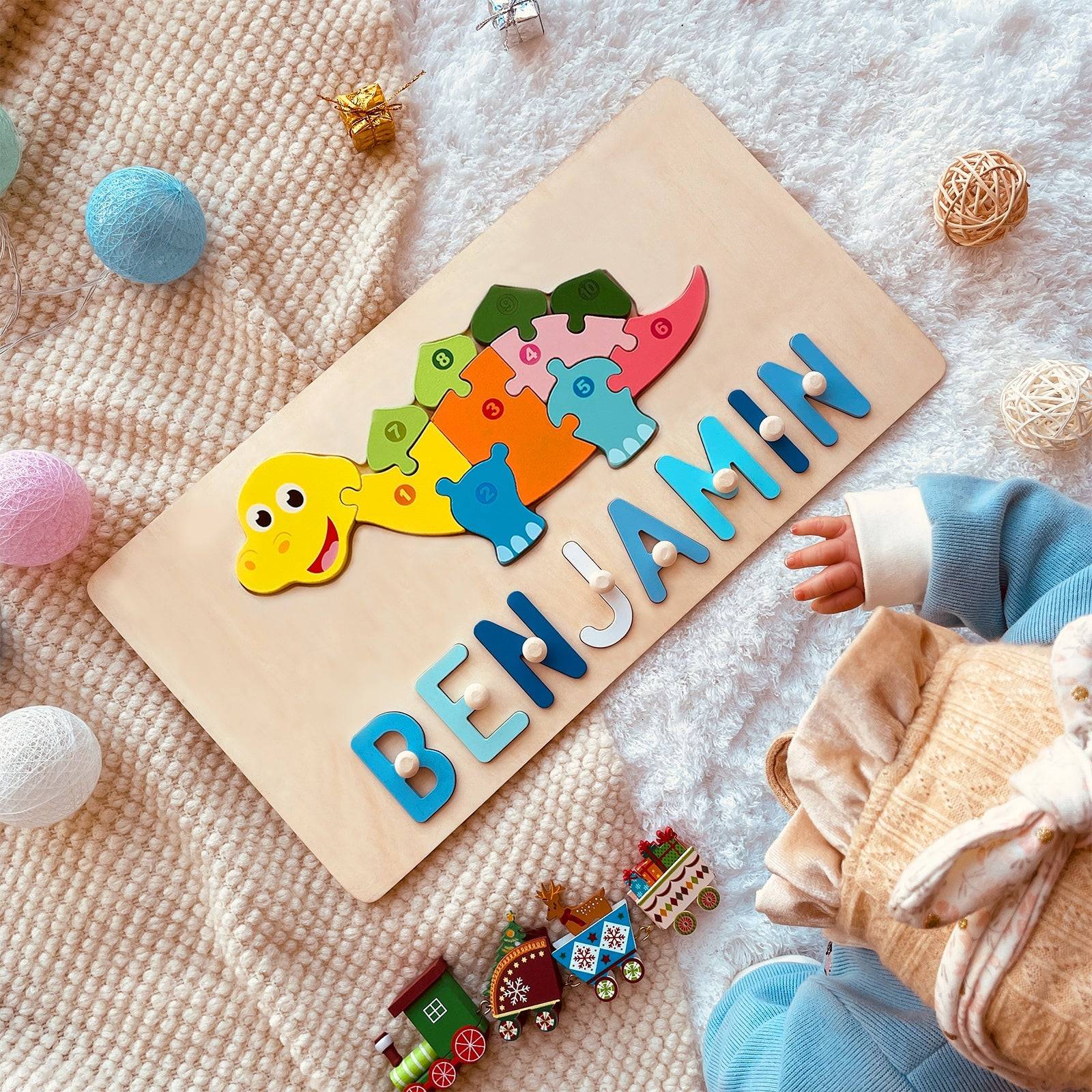 Personalized wooden name puzzle with dinosaur design, colorful letters spelling 'BENJAMIN', suitable for toddlers.