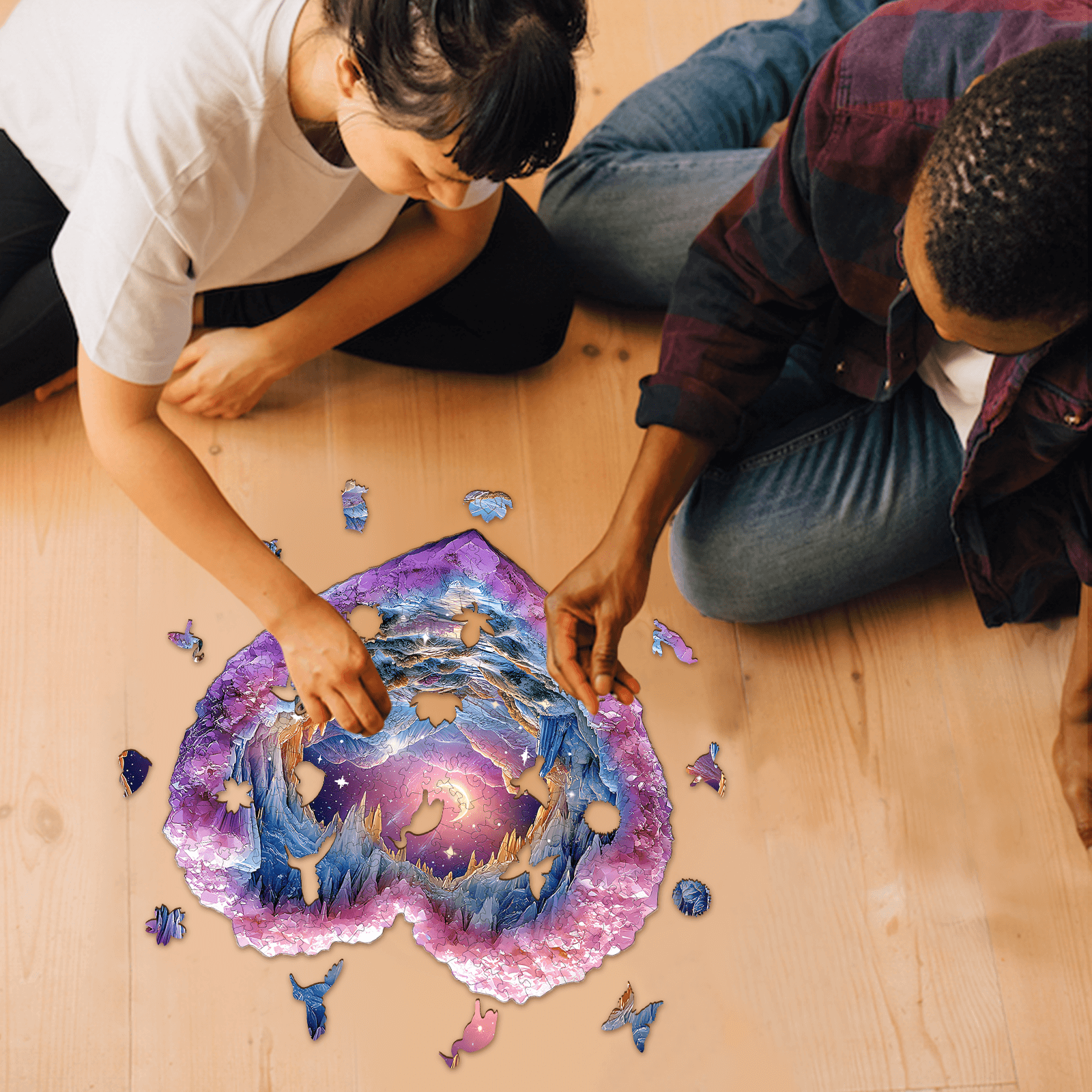 Couple assembling a 3D Romantic Star wooden jigsaw puzzle on the floor, enhancing focus and cognitive skills.