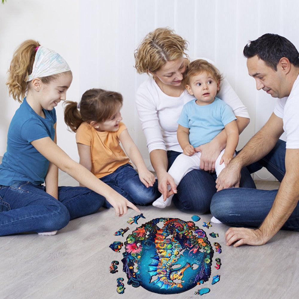 Family enjoying the Seahorse-2 wooden jigsaw puzzle together, showcasing marine life beauty for kids aged 8 and up.
