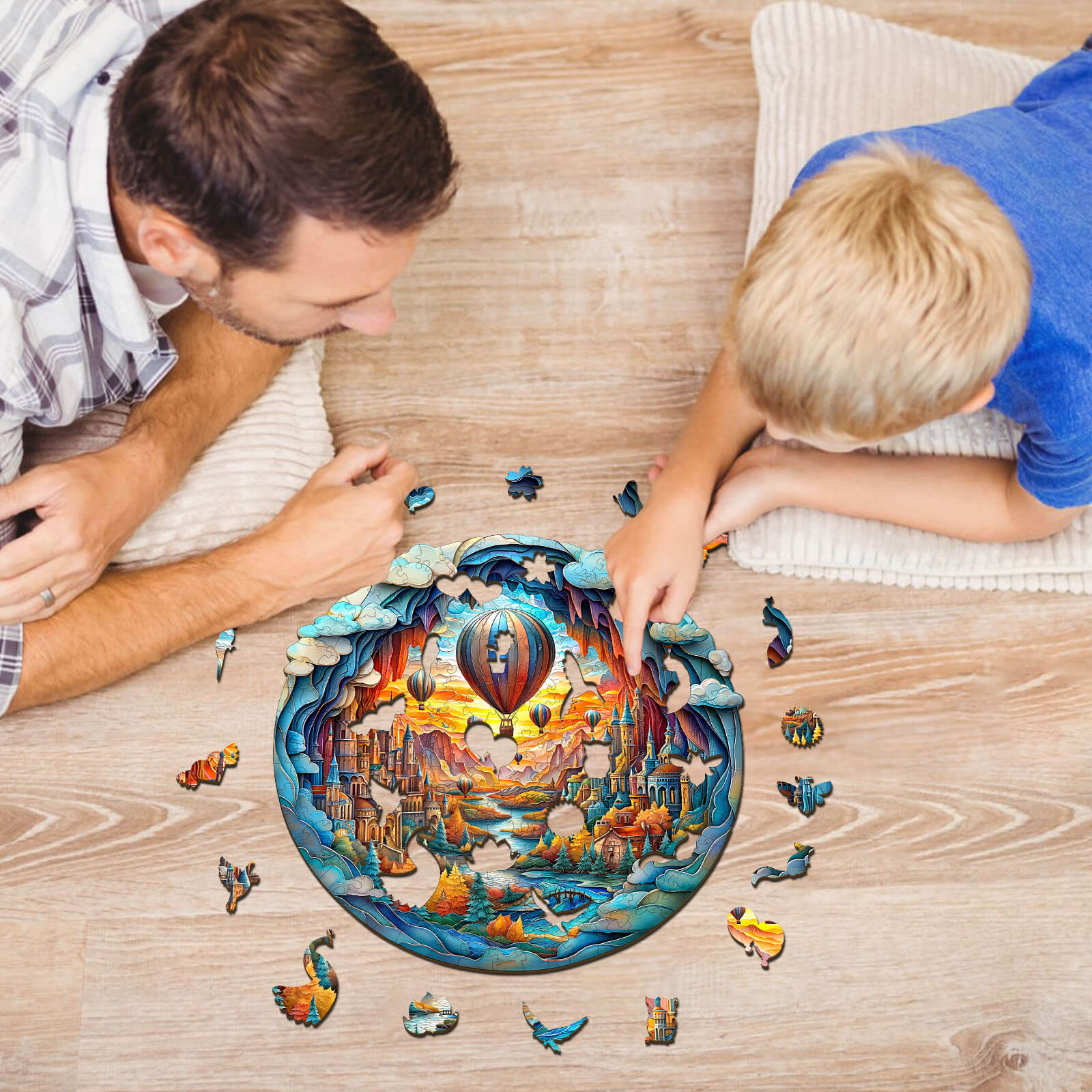 Father and son enjoying the 3D Balloon Town wooden jigsaw puzzle together, working on puzzle pieces for family fun.
