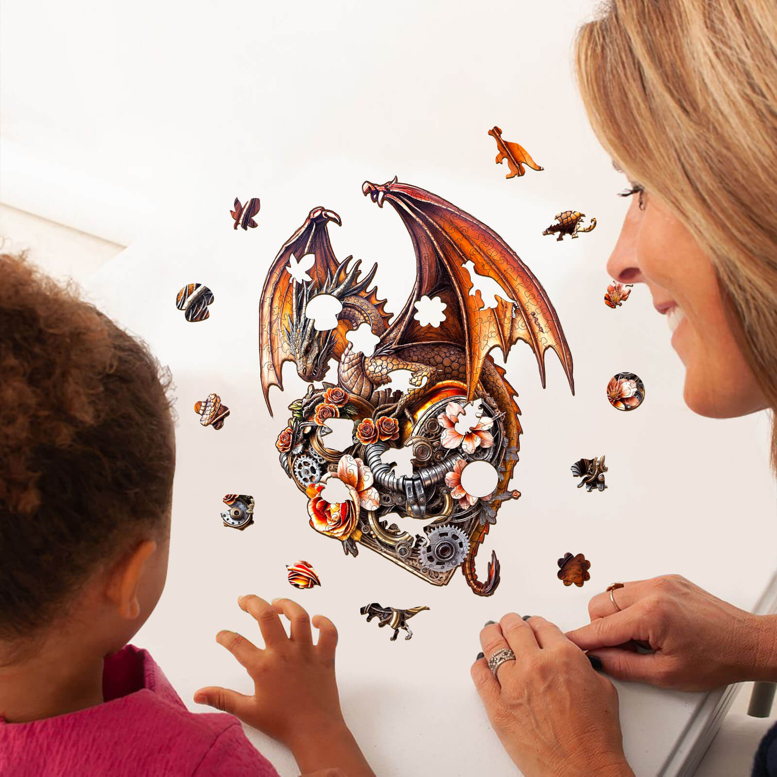 Mother and child assembling the Dragon Heart Machina wooden jigsaw puzzle, engaging in a fun, focused activity.