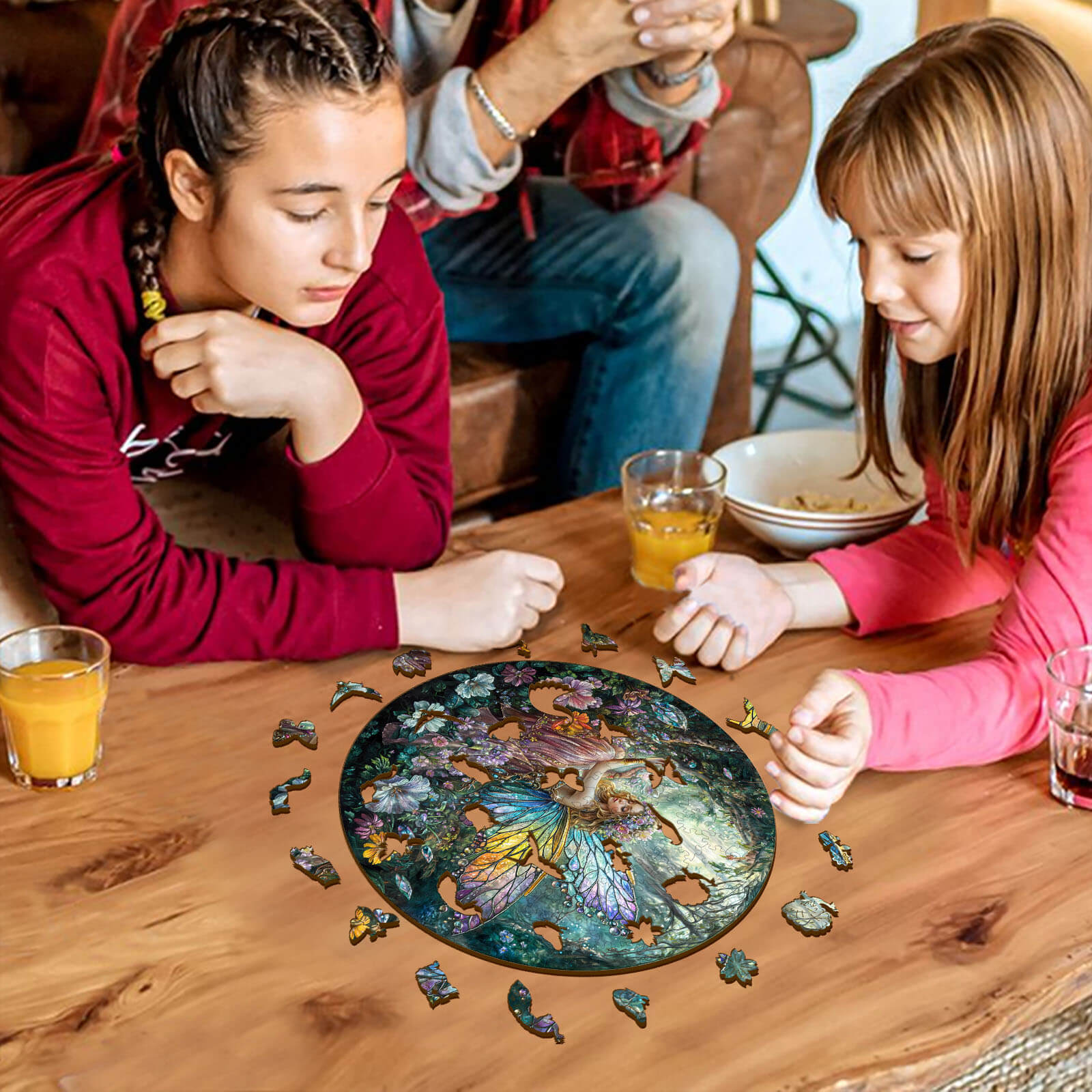 Two children focused on assembling a Magic Fairy wooden jigsaw puzzle at a cozy table, enhancing concentration and cognitive skills.