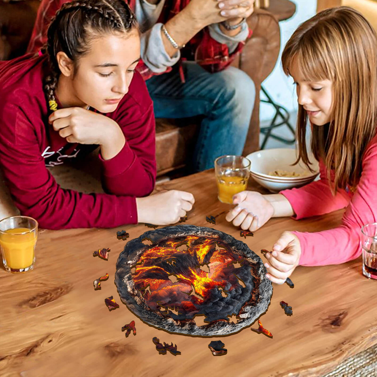 Two girls enjoying a 3D Volcanic Eruption wooden jigsaw puzzle on a table, enhancing focus and fun.
