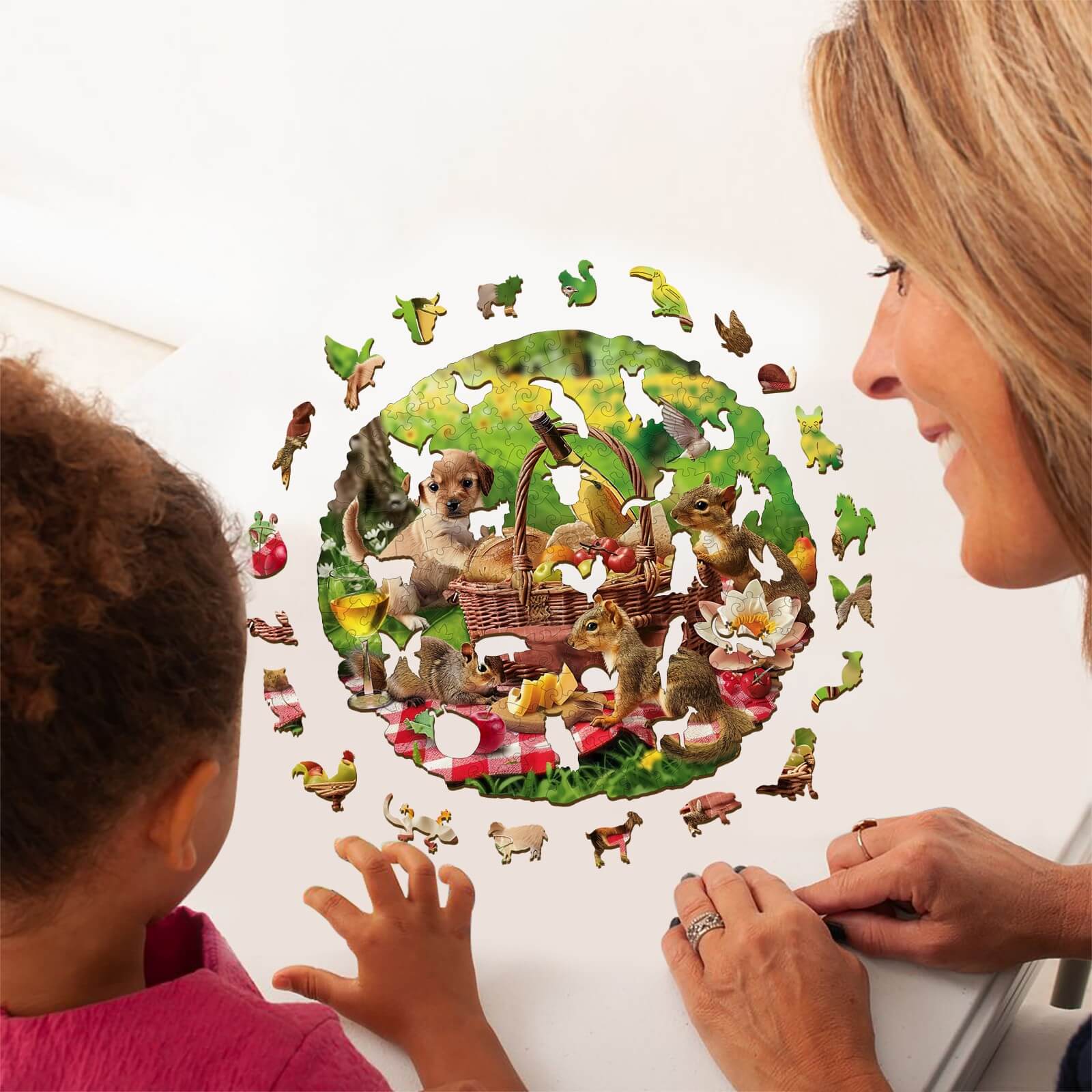 Adult and child enjoying the Animal Picnic wooden jigsaw puzzle, featuring playful animals and vibrant colors.