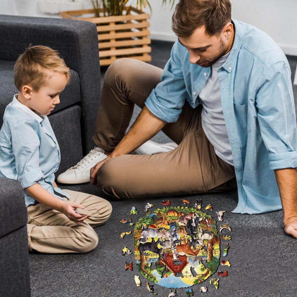 Father and son enjoying time together, assembling a Fun Farm Wooden Jigsaw Puzzle on the floor.