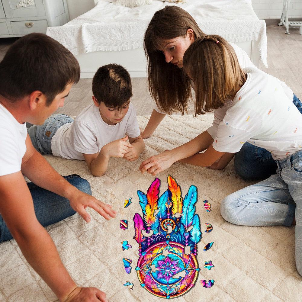 Family enjoying the Mandala Dream Catcher Wooden Jigsaw Puzzle on the floor, showcasing vibrant colors and intricate design.