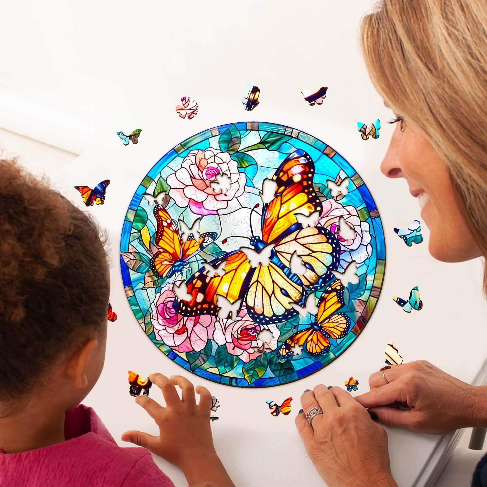 Woman and child assembling a stained glass butterfly jigsaw puzzle, enhancing focus and creativity through mindfulness.