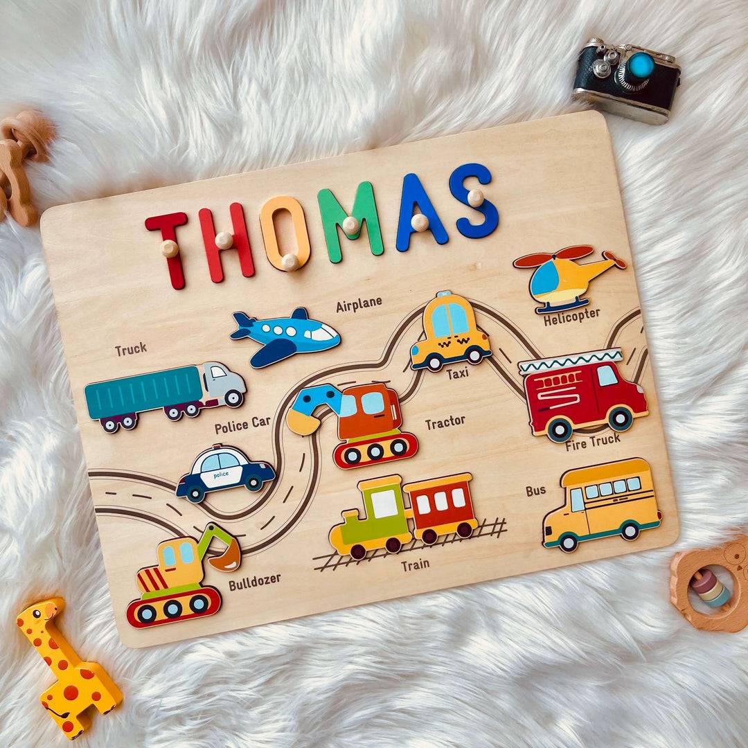 Personalized traffic name puzzle with colorful vehicles and the name 'THOMAS' for educational play.