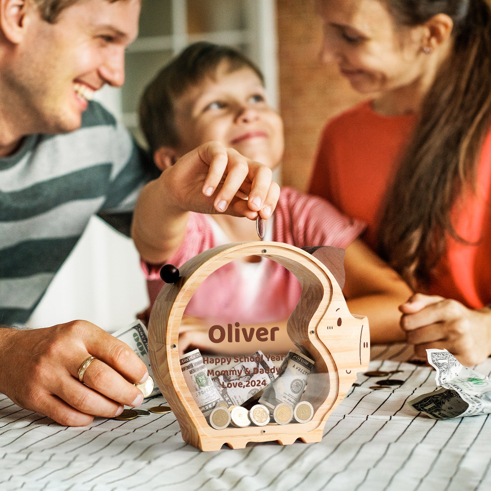 Family enjoying time together while using a custom piggy bank with coins and bills.