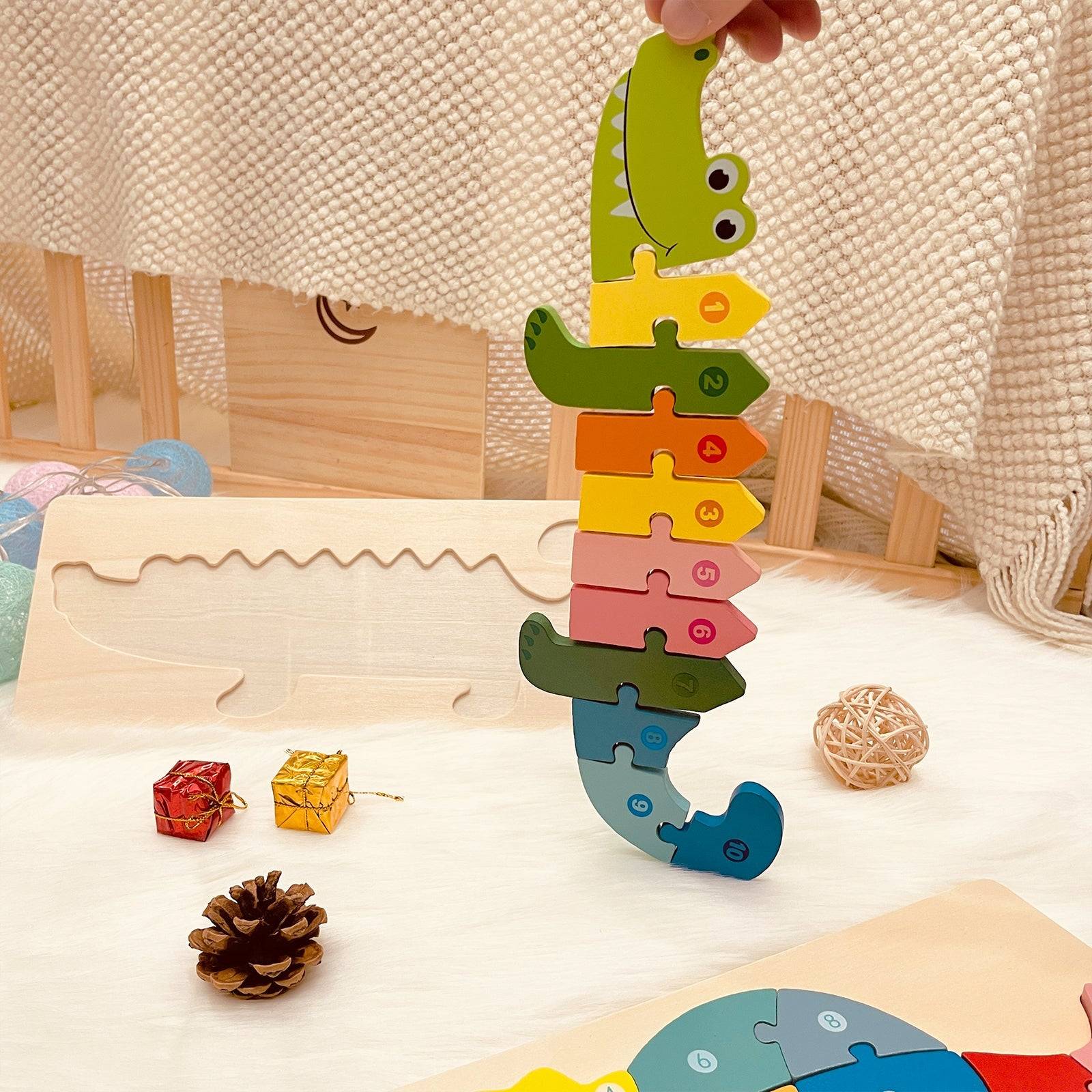 Colorful wooden name puzzle in the shape of an alligator, perfect for toddlers and eco-friendly play.