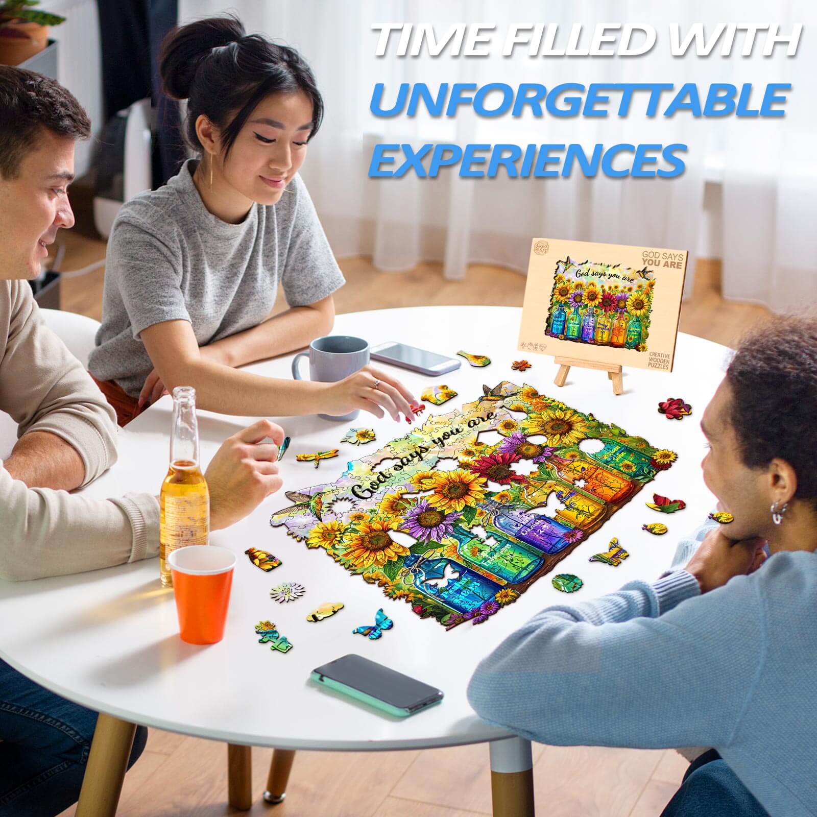 Three friends enjoying the God Says You Are wooden jigsaw puzzle at a table, highlighting fun and focus.