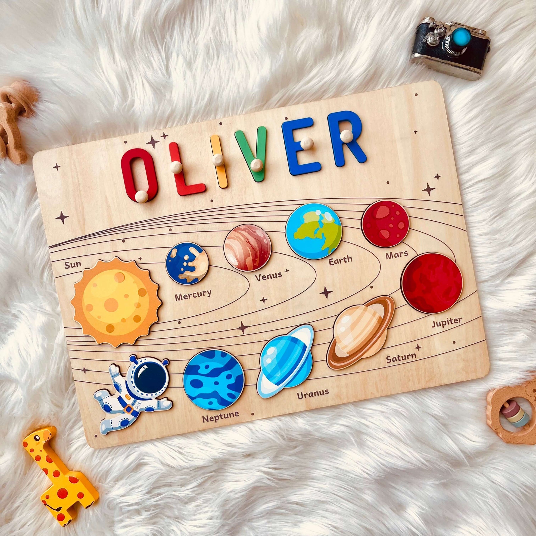 Personalized planet name puzzle featuring planets and name 'OLIVER' for educational play.
