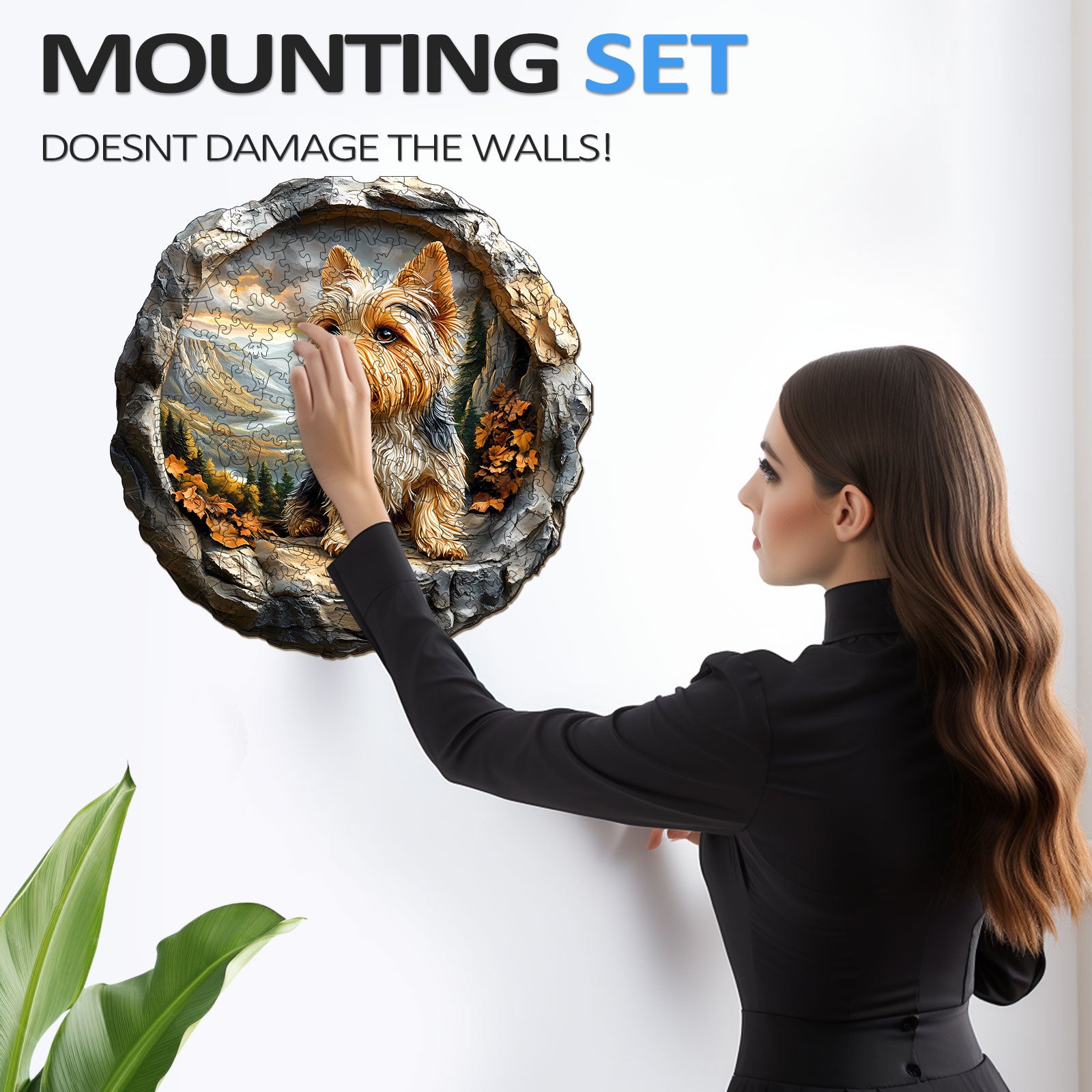 Woman mounting 3D Yorkshire dog artwork on wall with damage-free adhesive. Stylish decor for pet lovers.