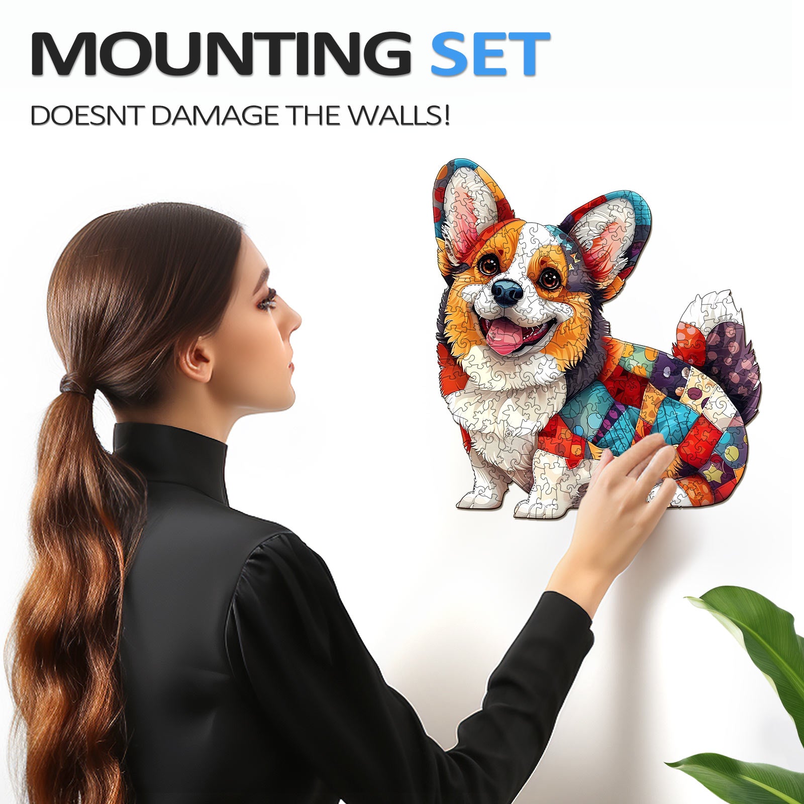 Woman mounting a colorful patchwork corgi puzzle on a wall without causing damage, showcasing the innovative design.