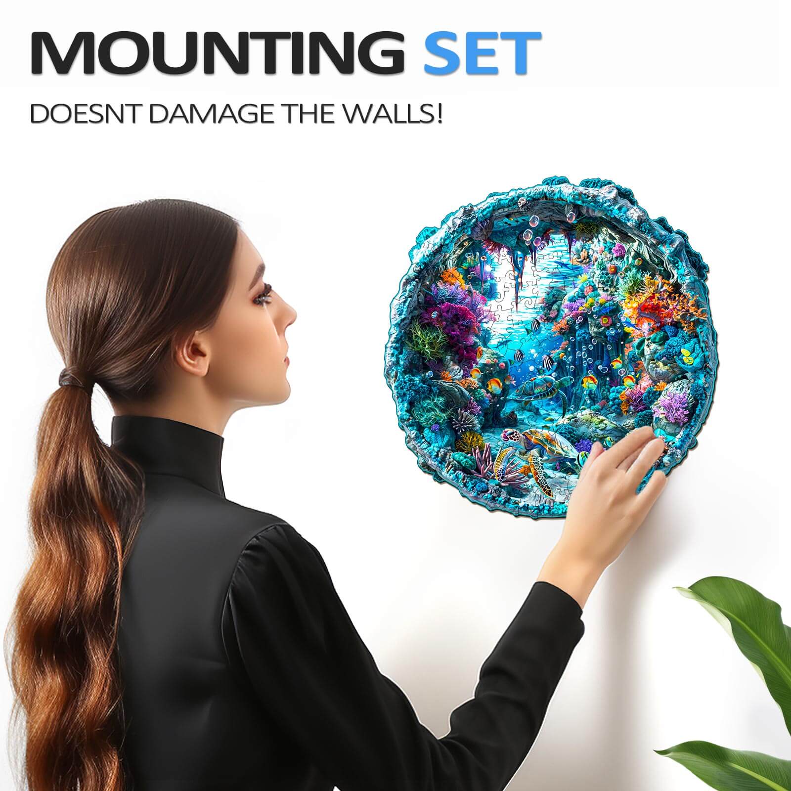 Person placing a 3D seabed wooden jigsaw puzzle on the wall with a mounting set that doesn't damage walls.