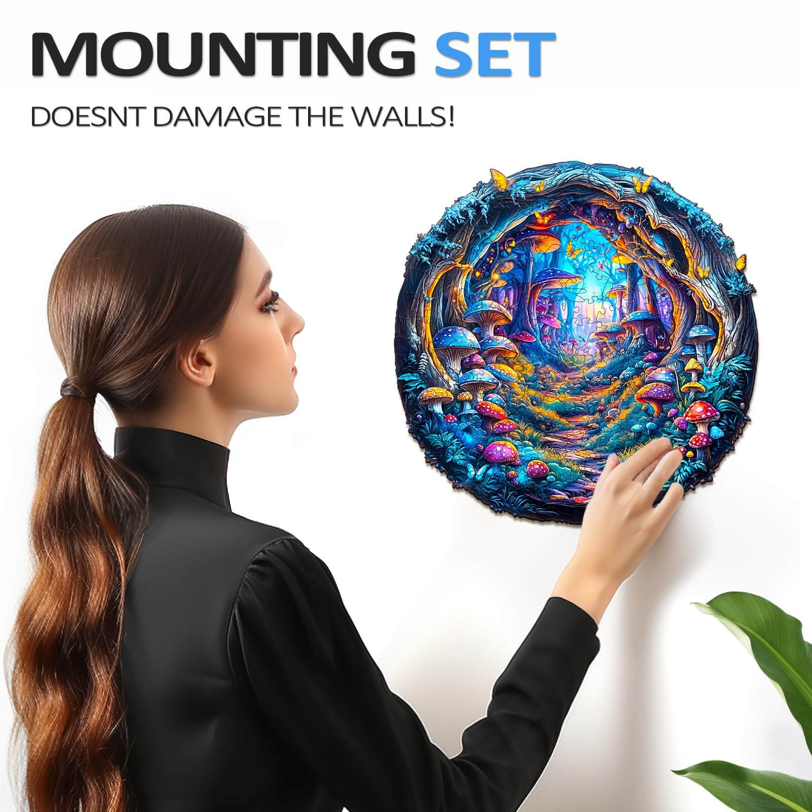 Woman installing a 3D Magic Mushroom wooden jigsaw puzzle on the wall using a mounting set.