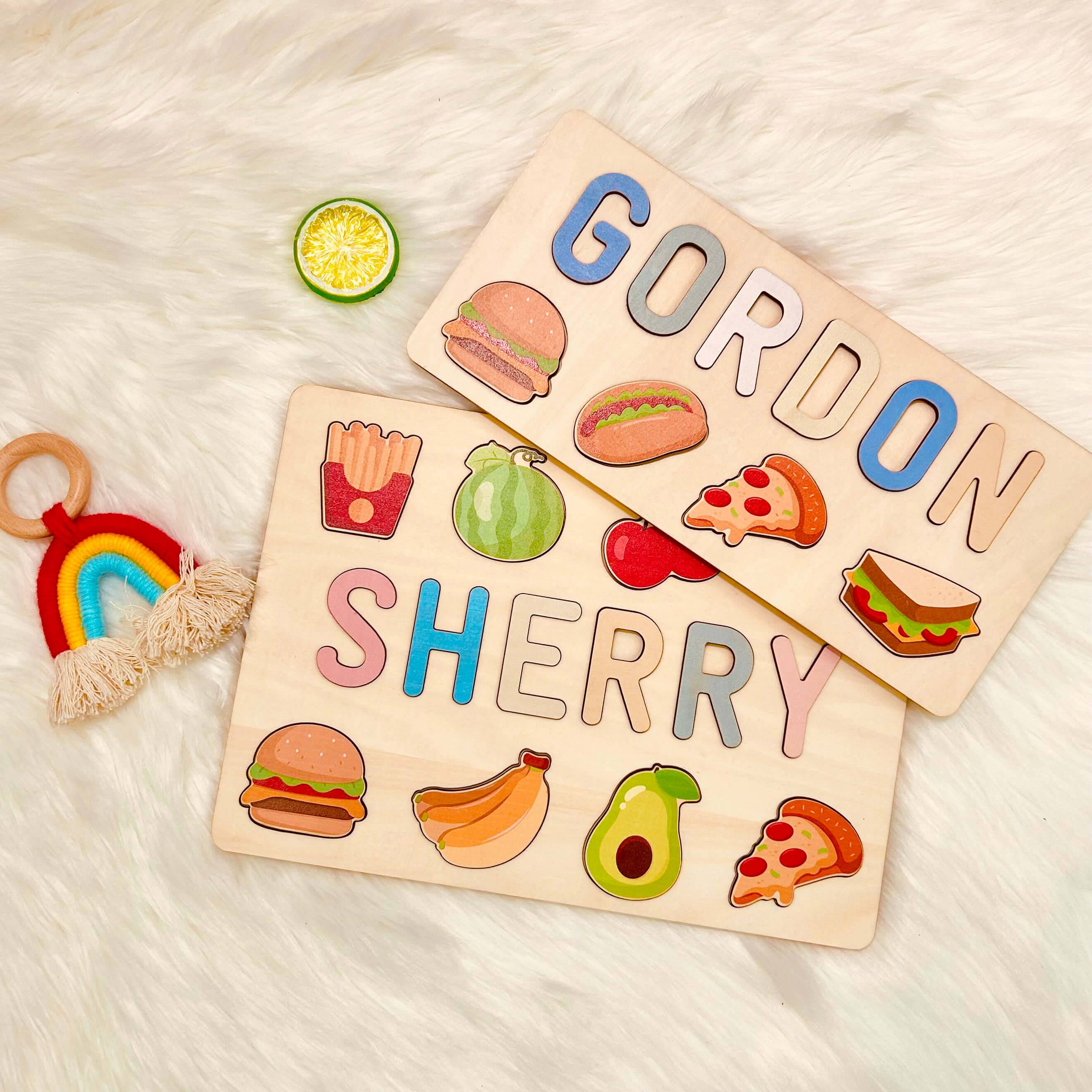Personalized wooden baby name puzzle with food illustrations and pastel letters, featuring names Gordon and Sherry.