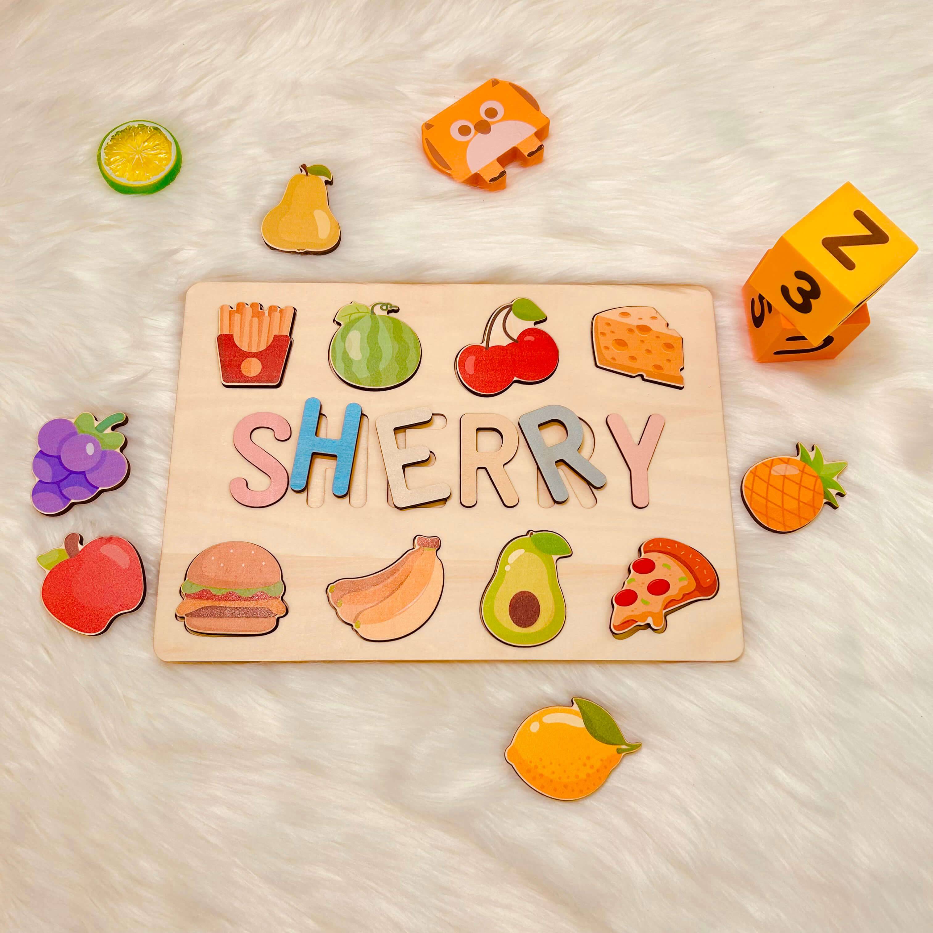 Personalized wooden baby name puzzle featuring food items with the name 'Sherry,' crafted from eco-friendly materials.