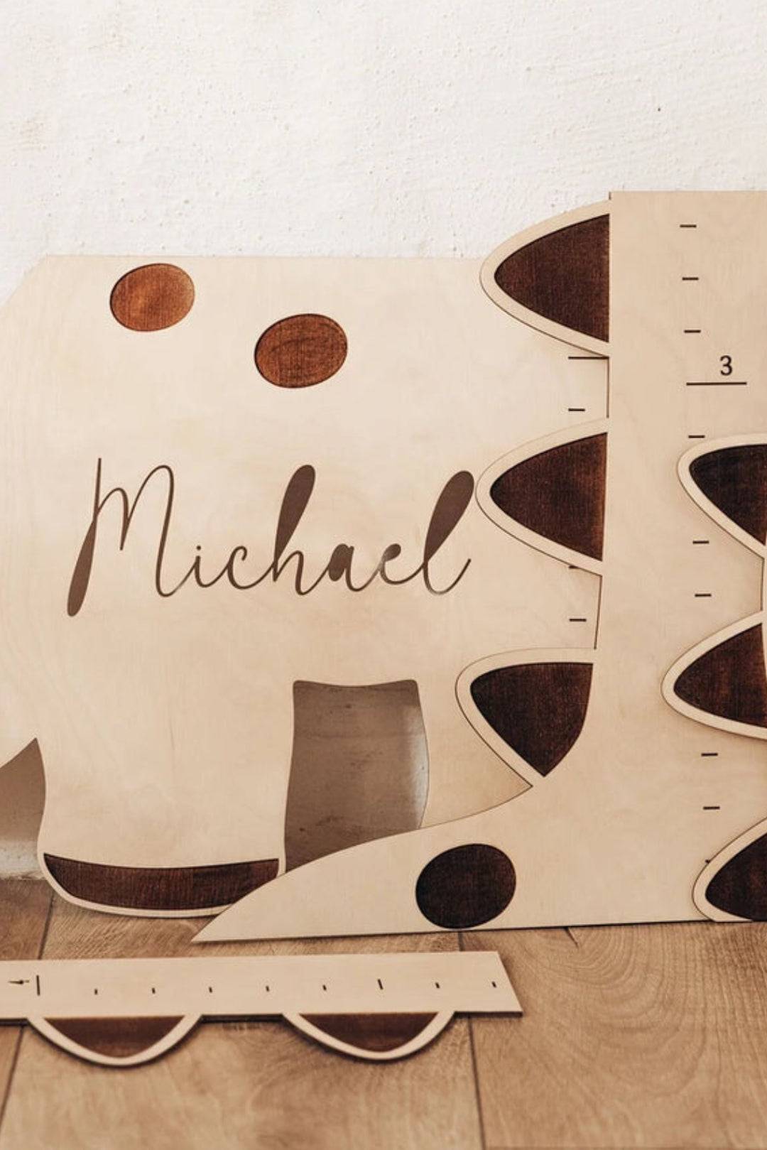 Personalized wooden dinosaur growth chart with name, perfect for children's growth tracking and nursery decor.