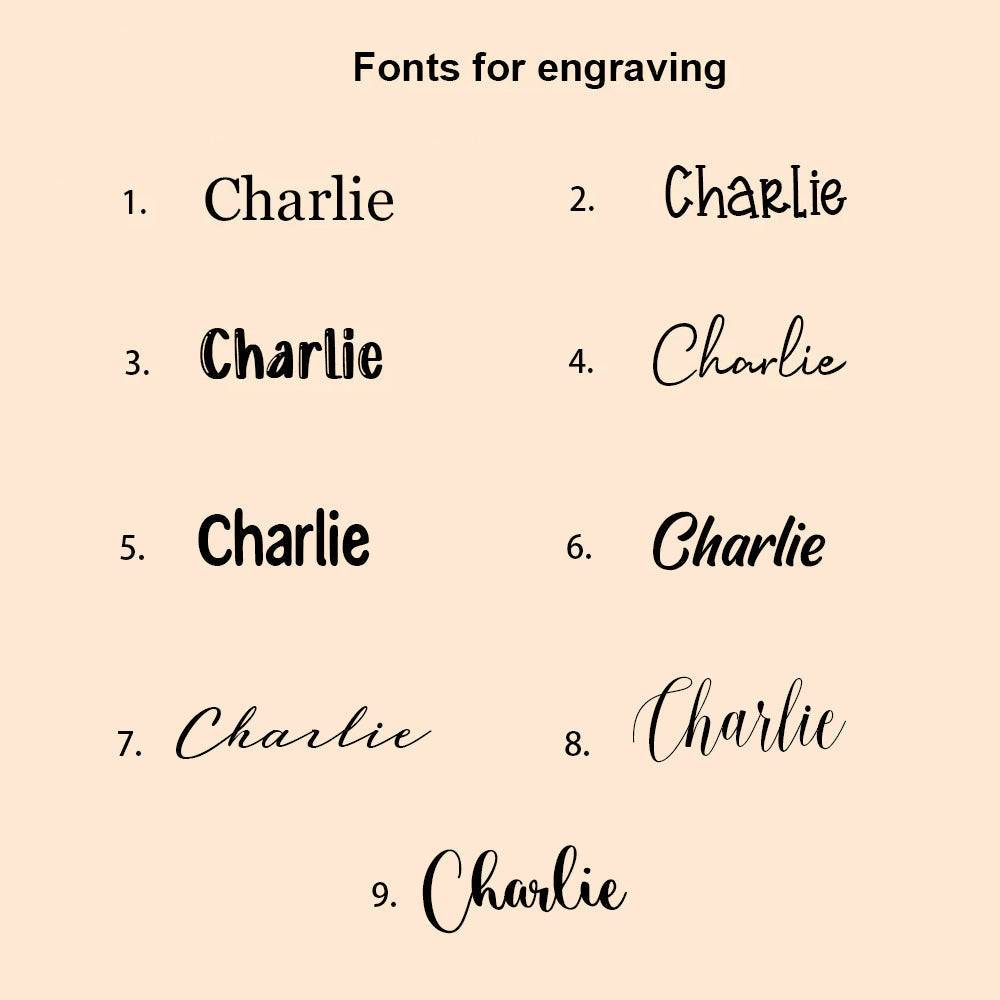 Engraving font options for personalized wooden letter piggy bank with the name Charlie.