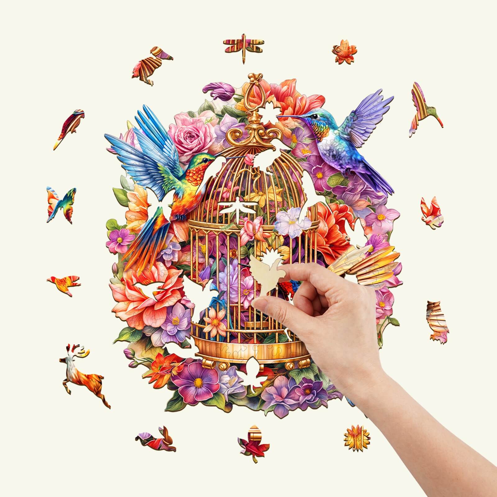 A hand placing a piece in a colorful Garden Symphony wooden jigsaw puzzle with birds and flowers.