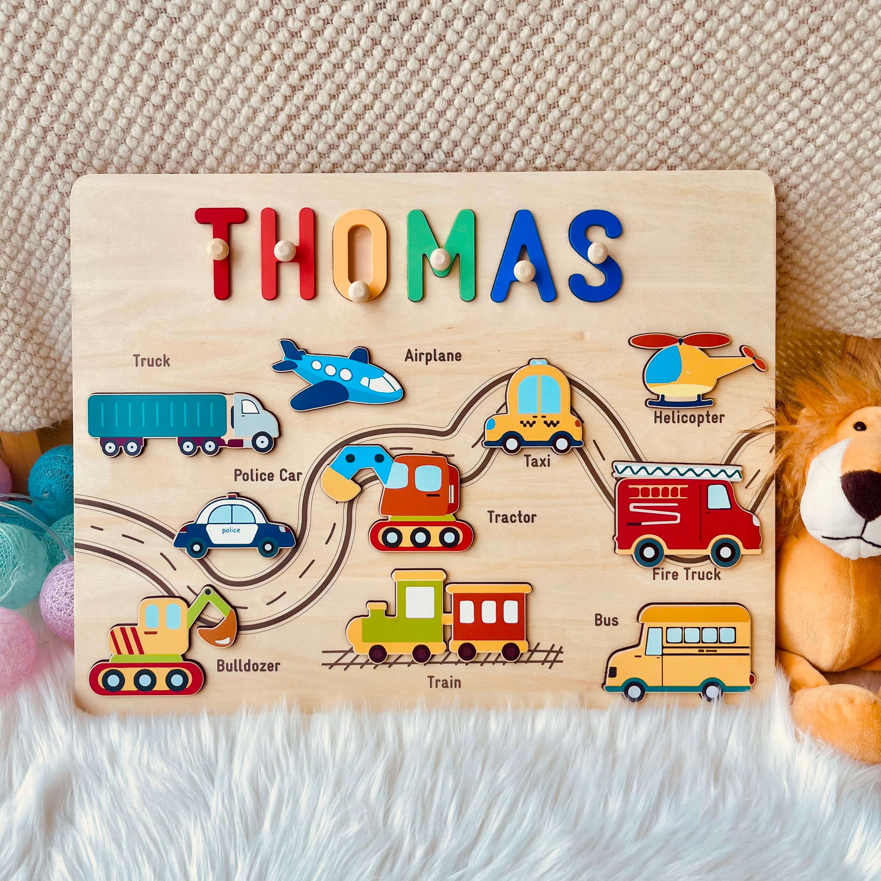 Personalized Traffic Name Puzzle for kids with colorful vehicles and the name 'THOMAS' on it.
