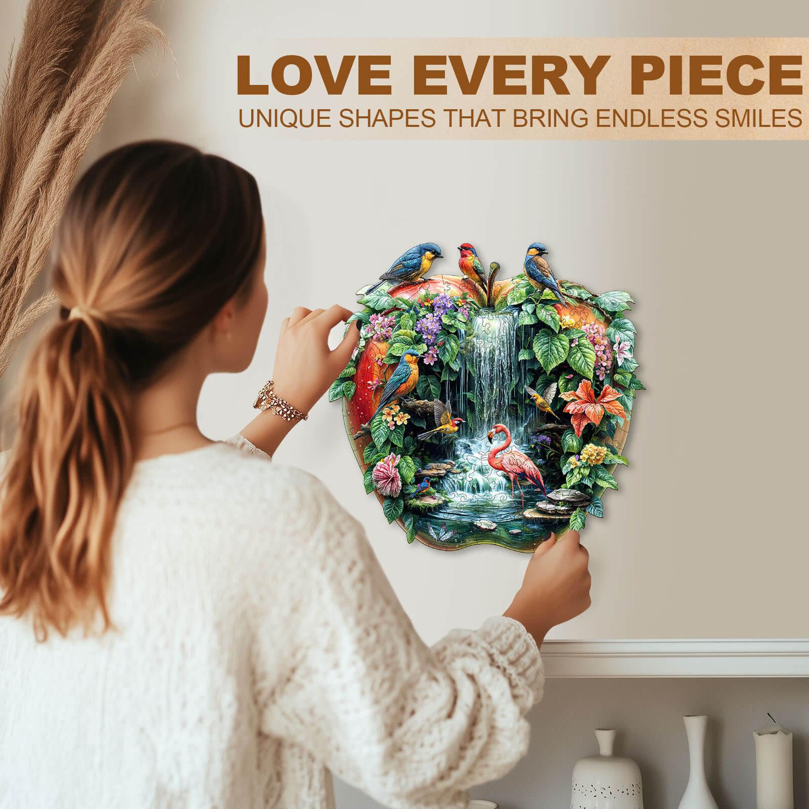 Person assembling a colorful Paradise Garden wooden jigsaw puzzle featuring birds and a waterfall for fun and focus.
