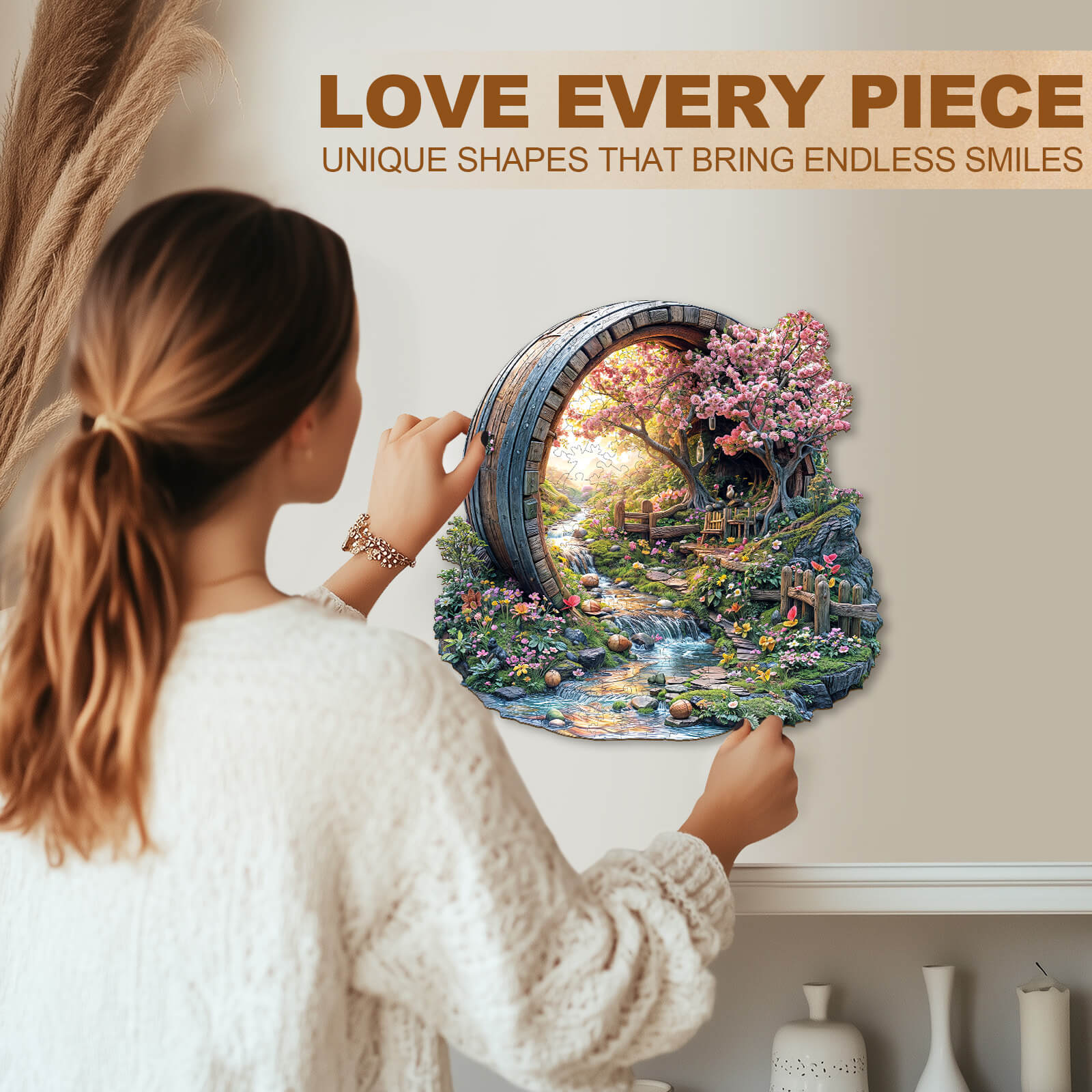 A woman assembling a Barrel of Spring wooden jigsaw puzzle, featuring a scenic landscape with cherry blossoms.