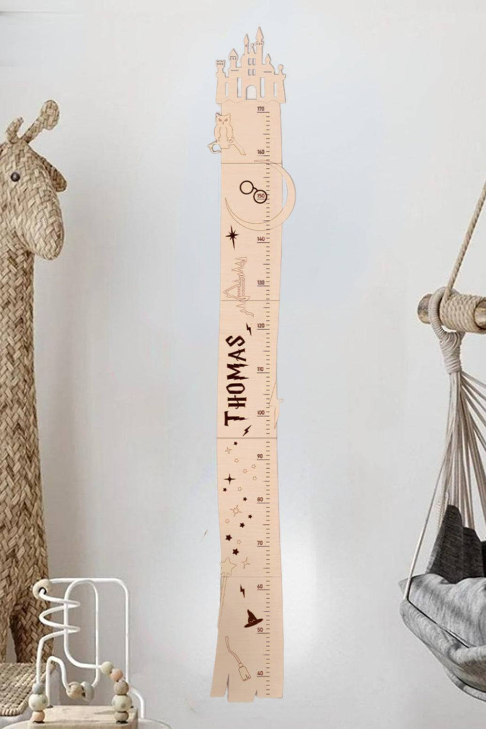 Personalized wooden castle growth chart for kids named Thomas, measuring height with a whimsical design.