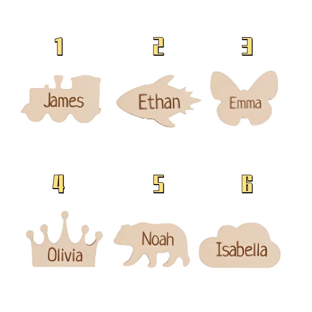 Personalized wooden markers for growth chart featuring names: James, Ethan, Emma, Olivia, Noah, Isabella.