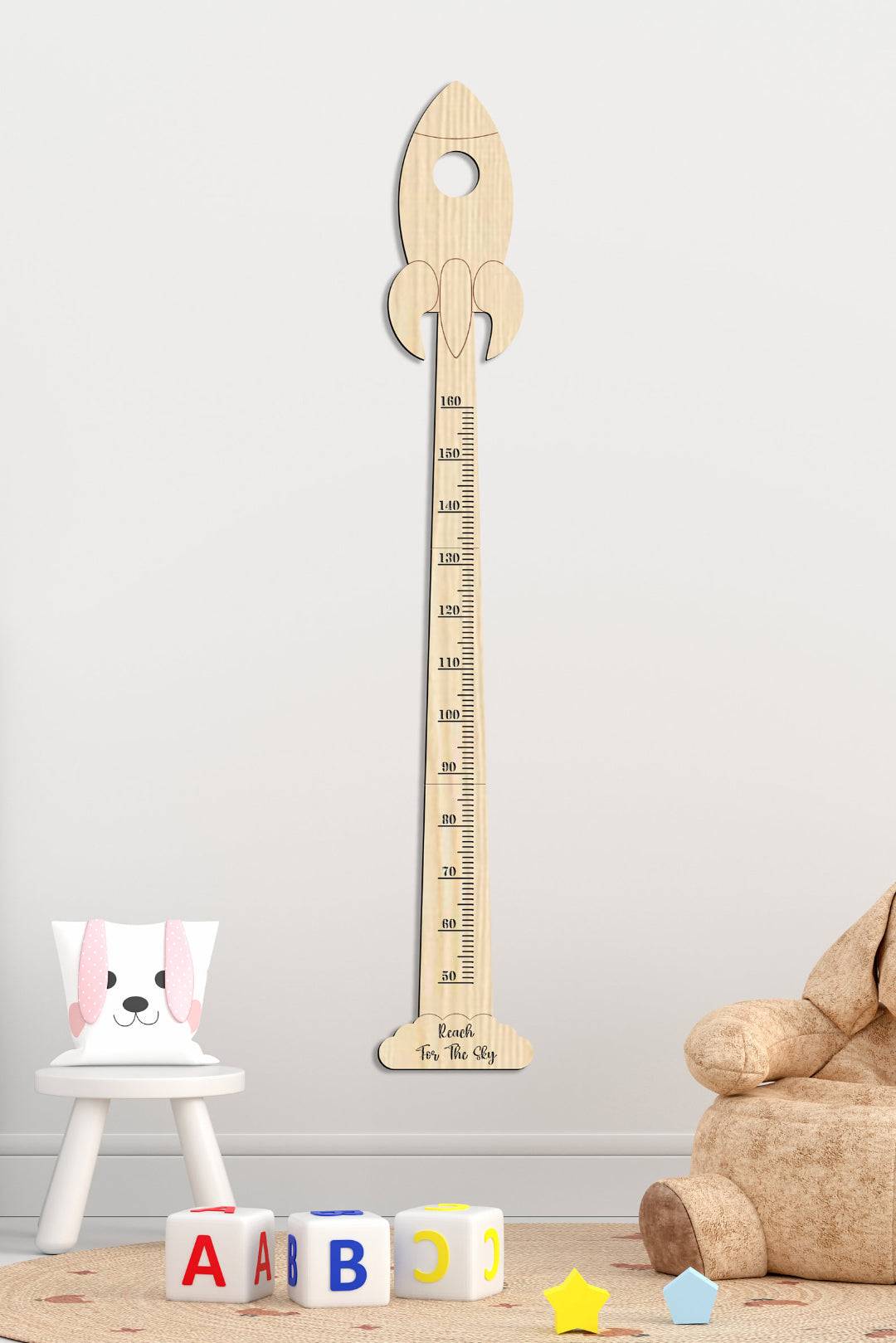 Personalized wooden rocket growth chart for nursery decor, measuring up to 6 feet tall.