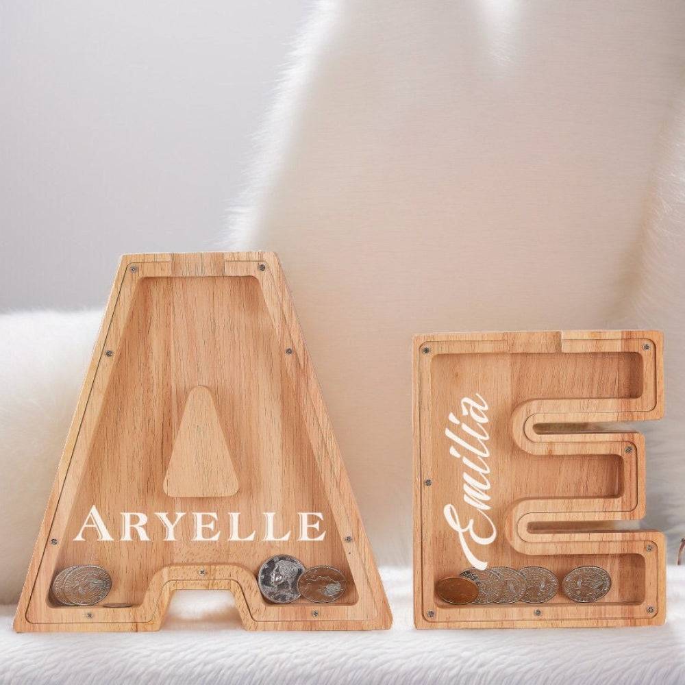 Personalized wooden letter piggy banks 'A' and 'E' for kids, promoting savings and financial awareness.